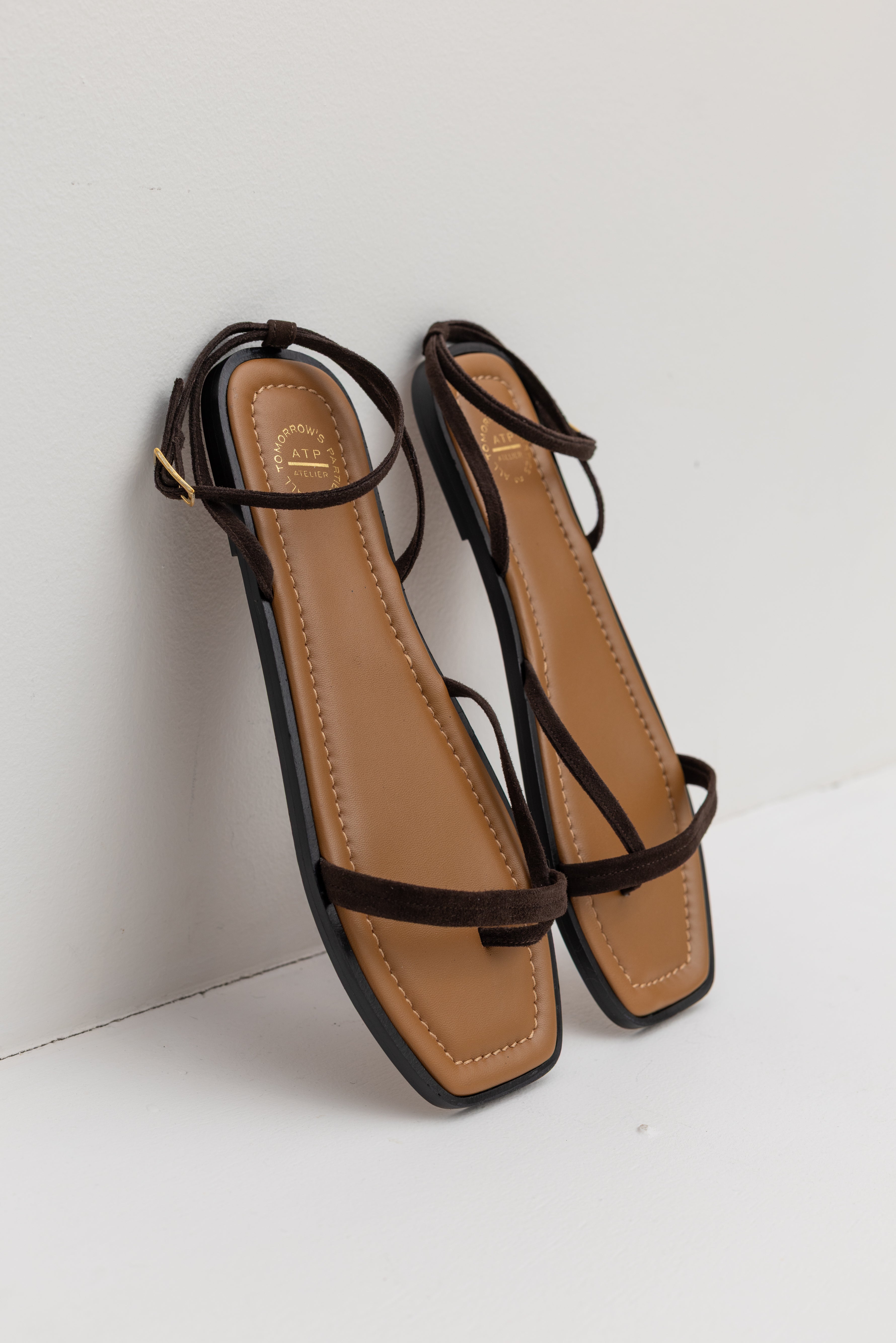 3/4 view of the ATP Spring / Summer Miane barely-there rich brown suede strappy sandal featuring delicate straps, a modern square toe, and a refined mid-heel at Alas Eius. 