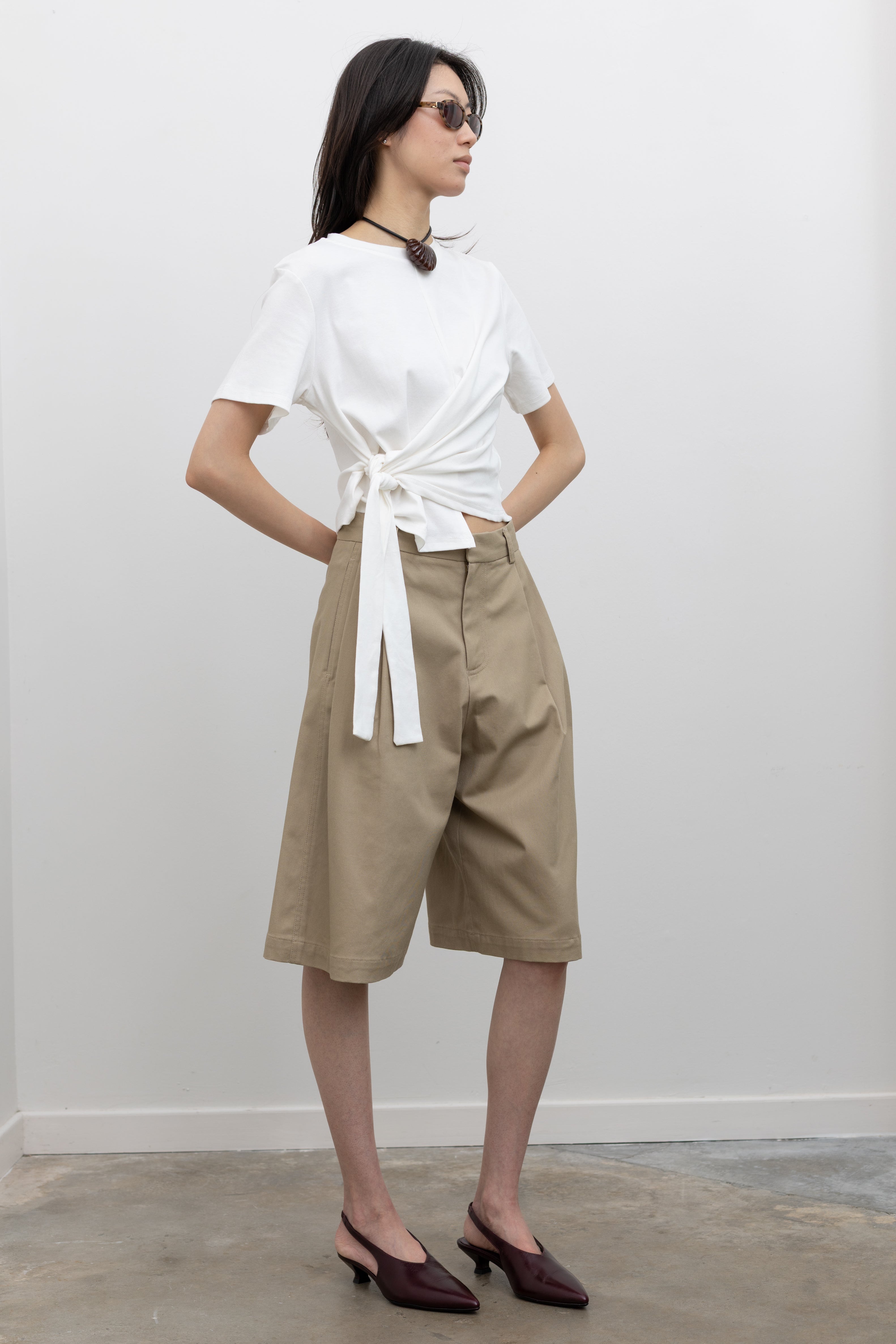 Casual women’s adjustable waist tie t-shirt in soft cotton blend featuring crew neckline, short sleeves, and front ruched gathering for a flattering fitted silhouette at Alas Eius
