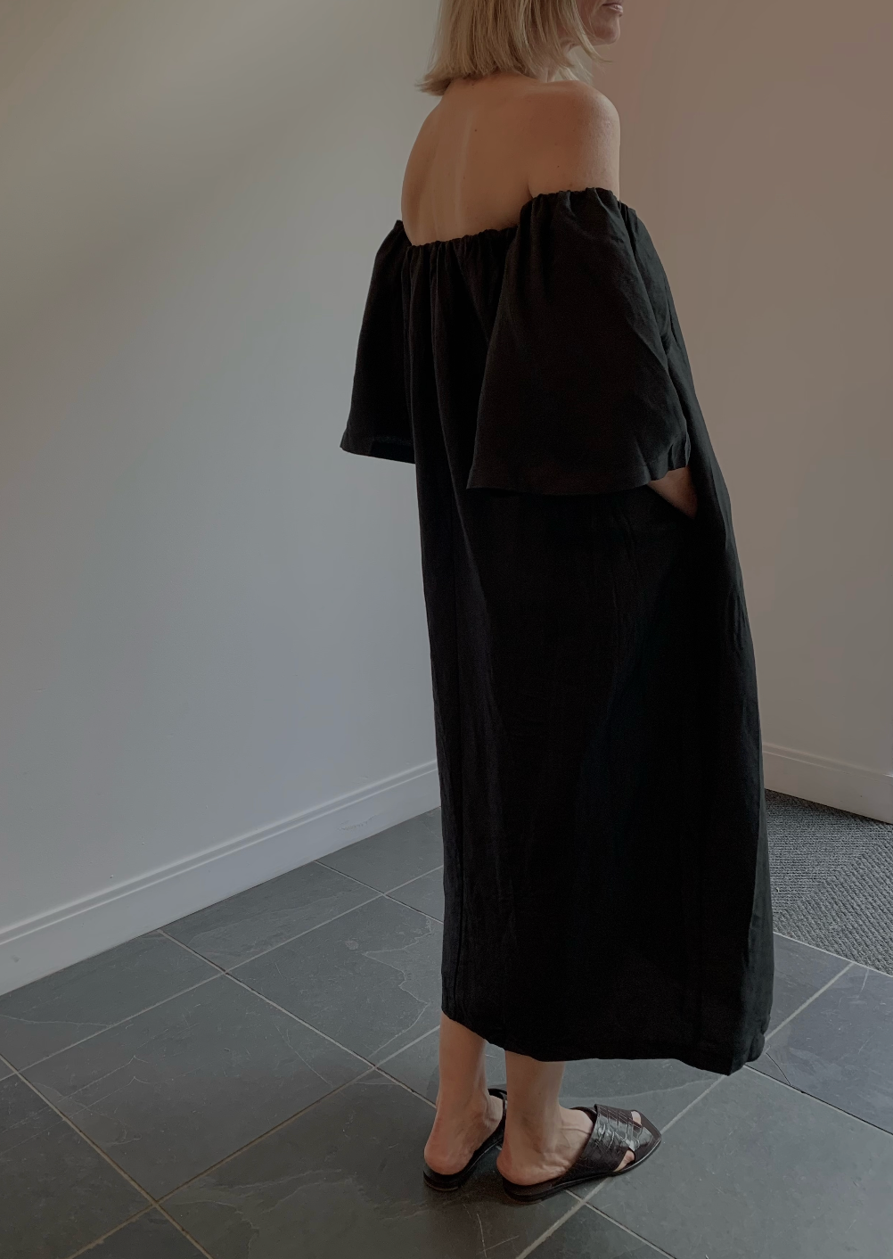 Alas Eius black linen off the shoulder midi dress angled view