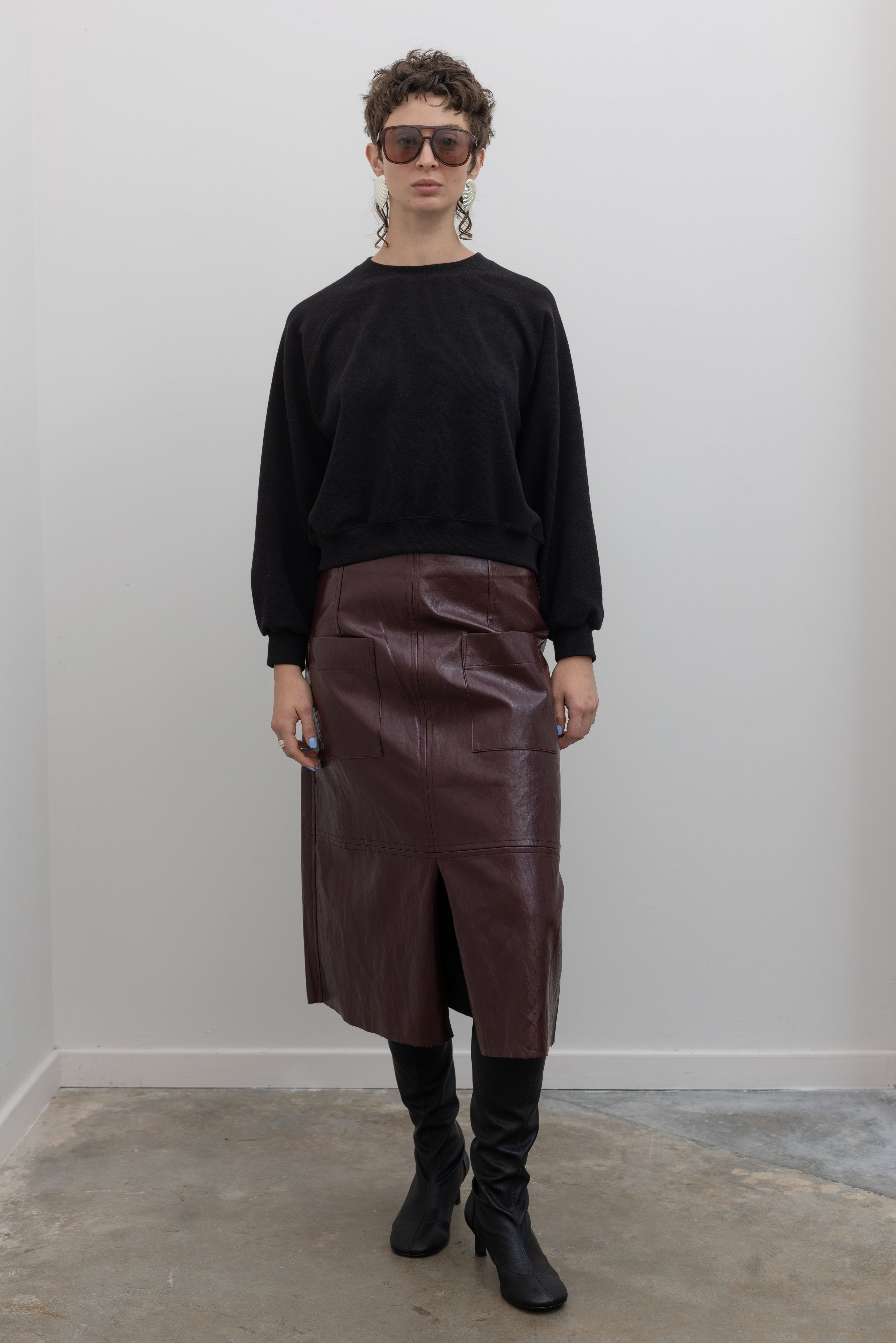 Alas Eius black raglan sleeve elevated essentials sweatshirt styled with brown leather midi skirt