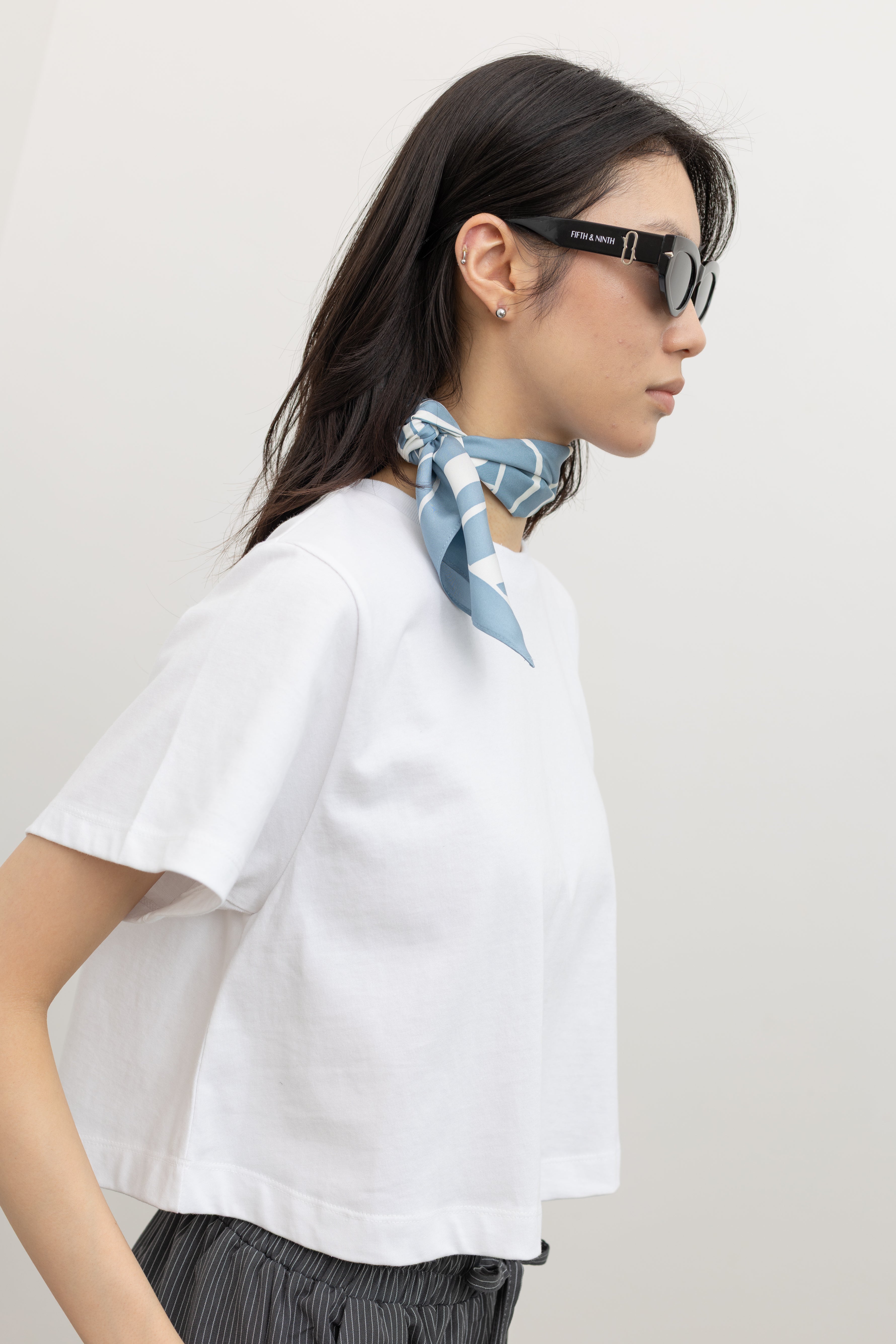 Relaxed cropped cotton tee by Alas Eius designed with an effortless silhouette, premium durable cotton, and a reinforced neckline that maintains structure wear after wear, perfect for high-waisted styling at Alas Eius.
