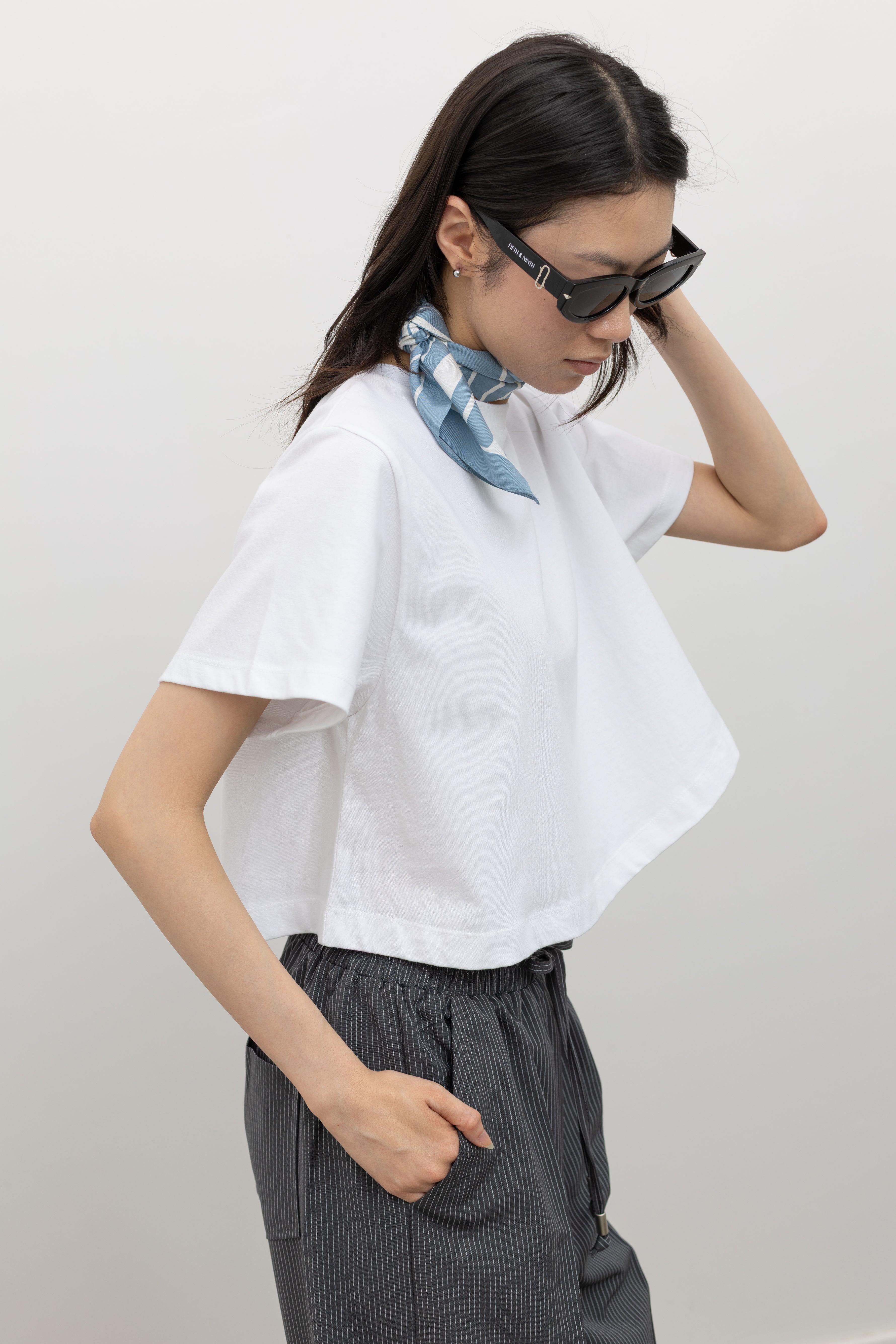 Minimal cropped cotton t-shirt by Alas Eius featuring an effortlessly cool relaxed silhouette, durable premium cotton fabric, and a structured neckline designed to hold its shape at Alas Eius.