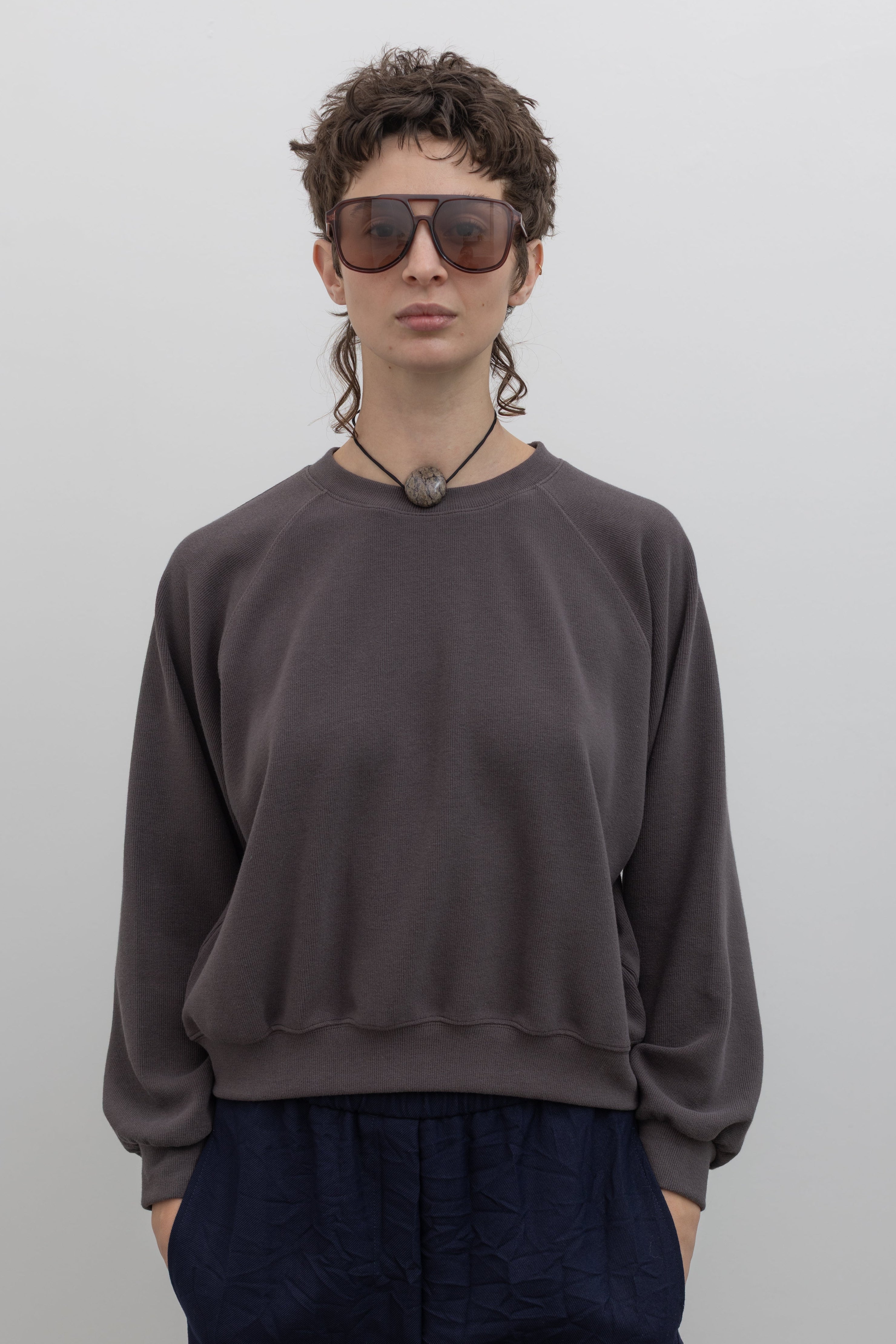 Alas Eius mocha brown raglan sleeve sweatshirt with relaxed fit, front view, styled on model against a neutral background