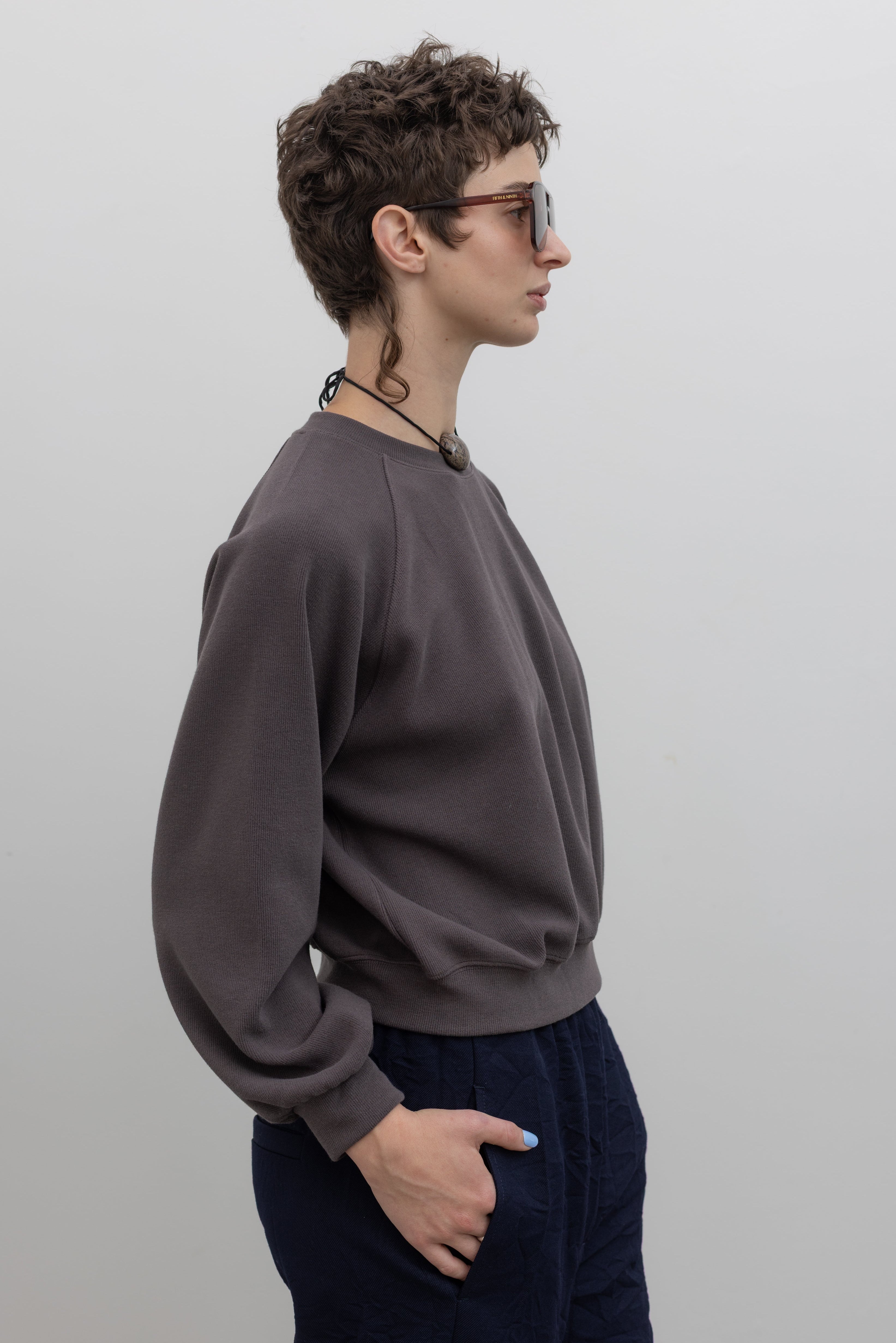 Mocha brown raglan sleeve sweatshirt with relaxed fit, styled on model against a neutral background