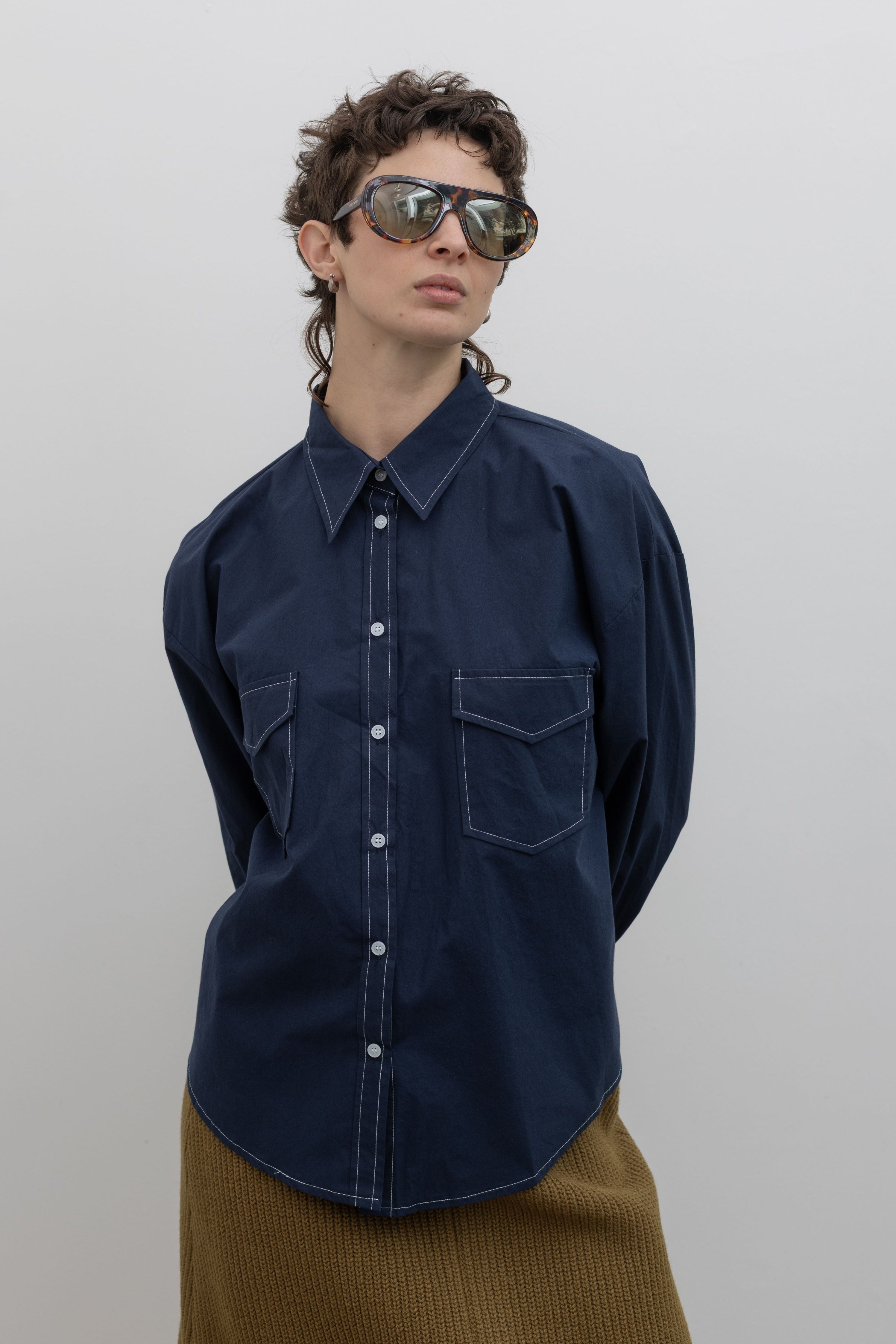 Alas Eius navy contrast stitch oversized button down shirt with visible contrast stitching, front view