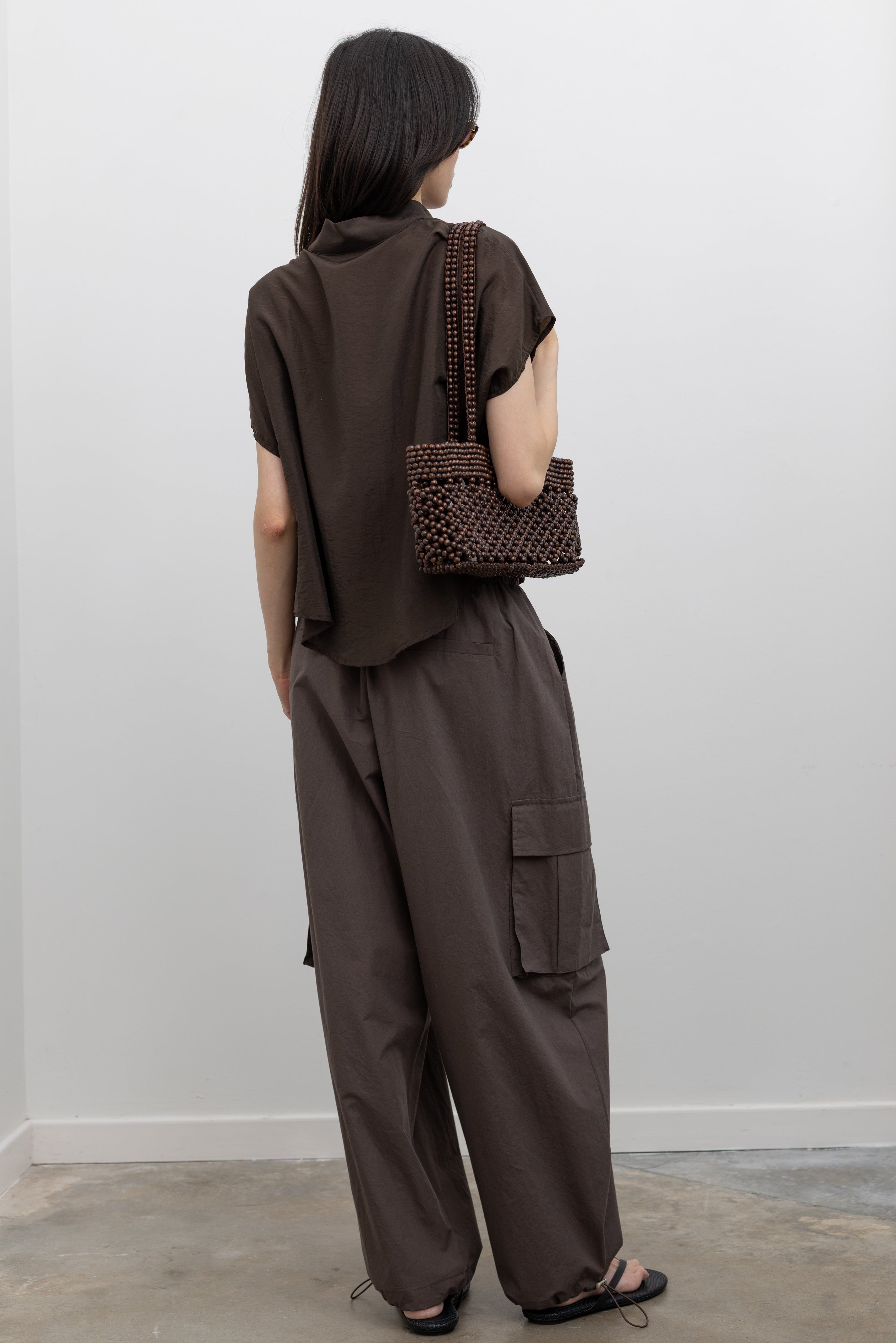 Alas Eius relaxed wide leg cargo pants featuring soft premium cotton construction, customizable fit, and utility-inspired pockets, styled as elevated everyday fashion bottoms for women at Alas Eius