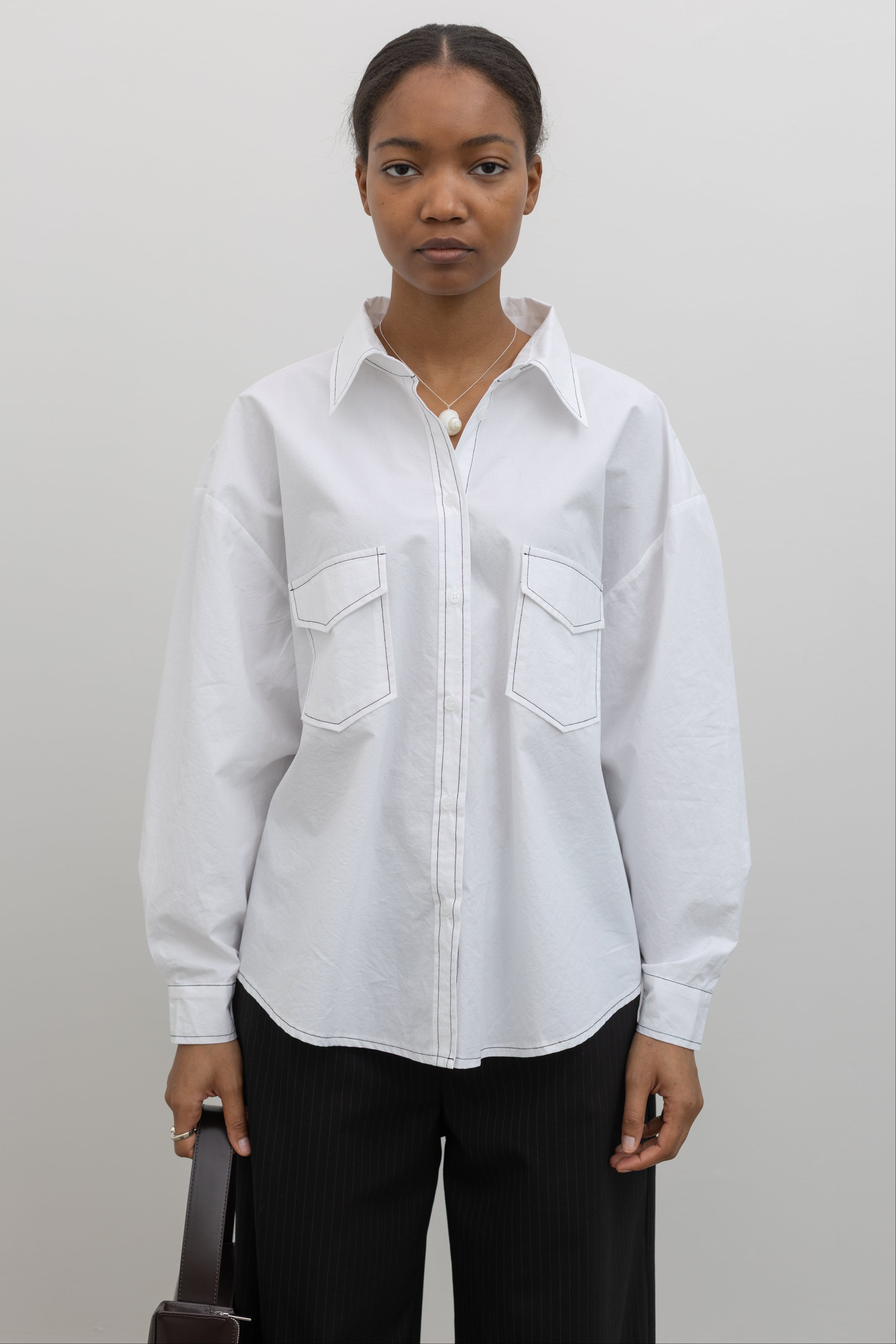 Alas Eius white contrast stitch oversized button down shirt, front view