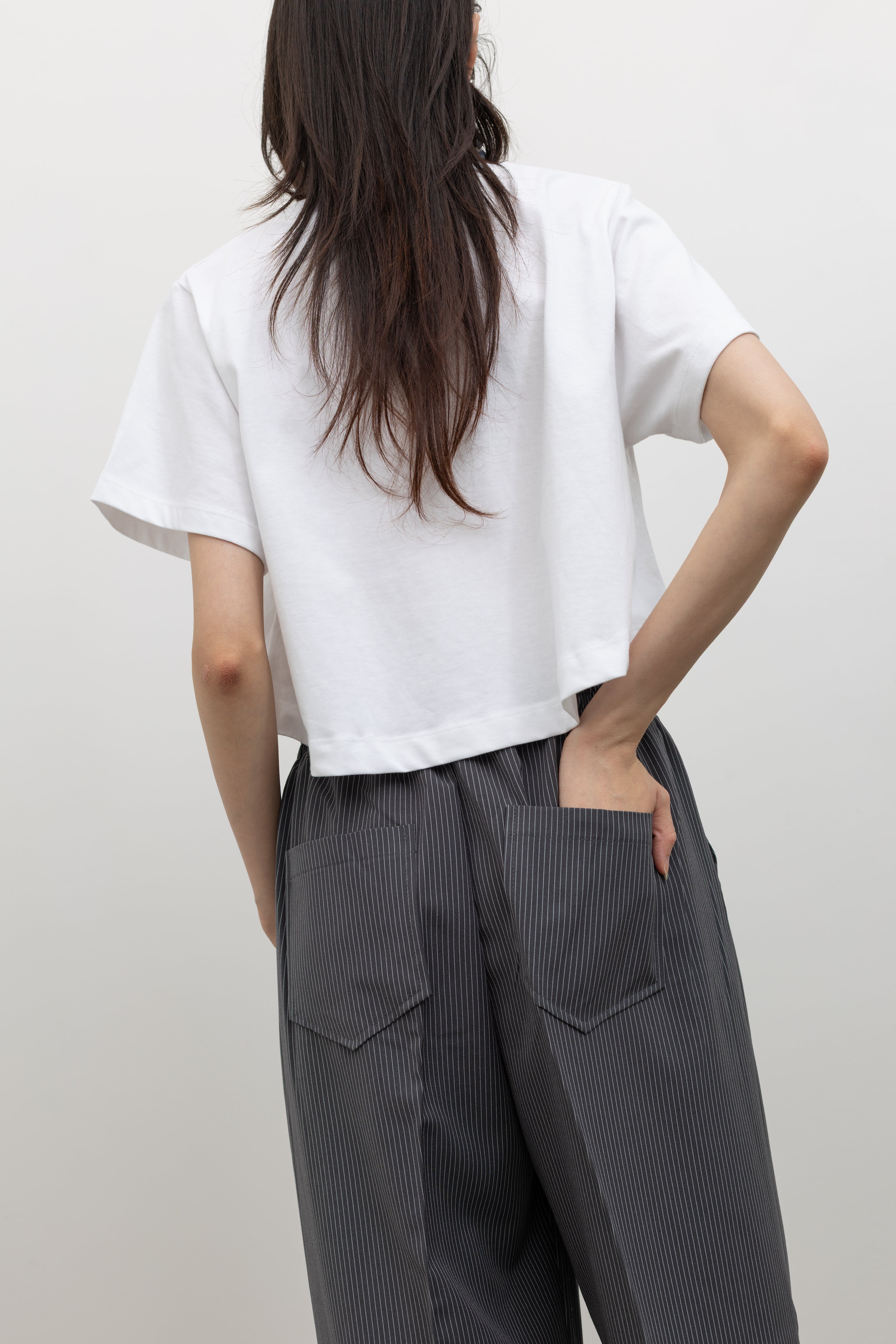 Elevated everyday cropped tee by Alas Eius crafted in premium cotton with a relaxed fit silhouette, cropped length, and reinforced neckline for a crisp, structured finish at Alas Eius.