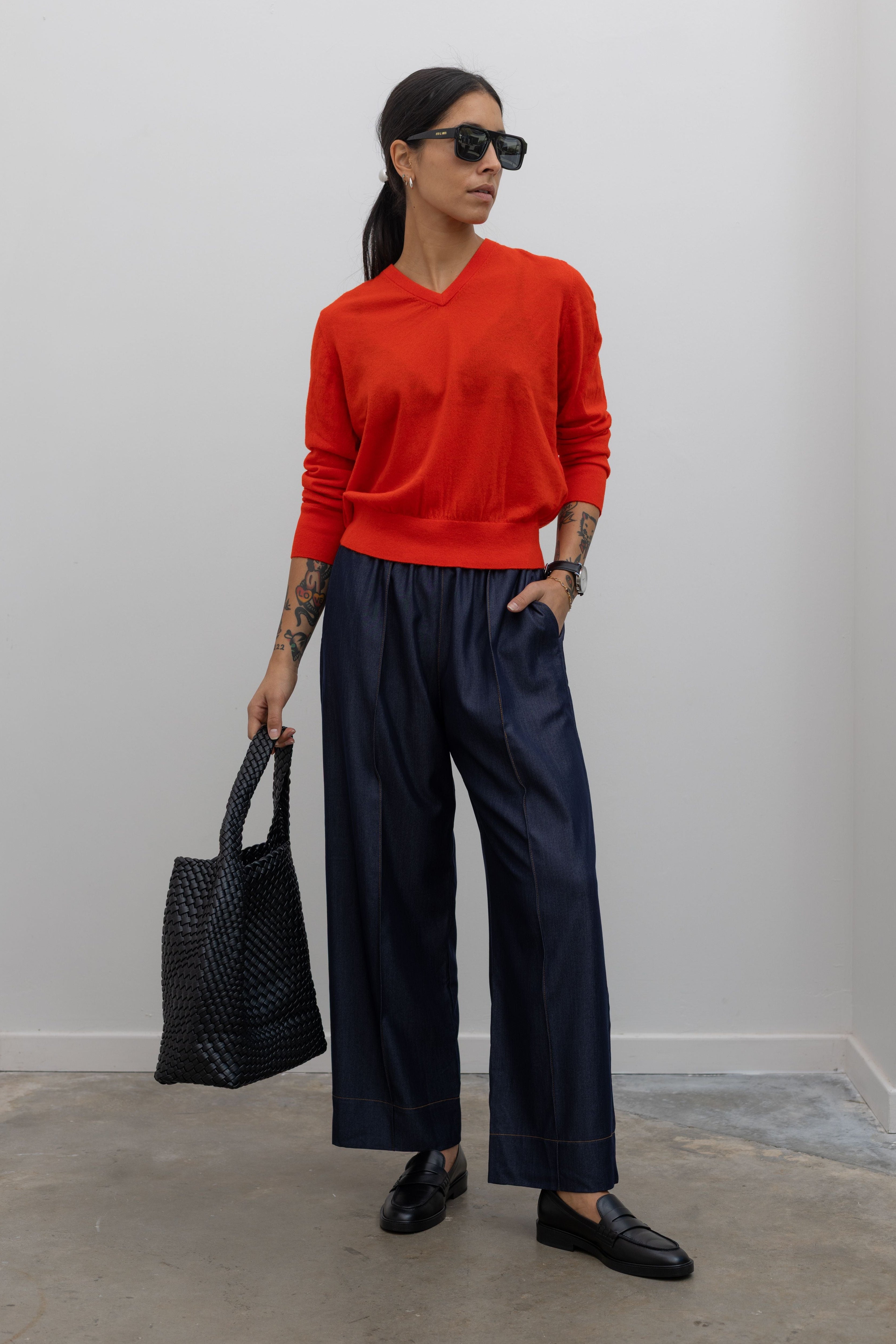 Tibi red cashmere v neck sweater with alas eius dark wash pull on tailored pants