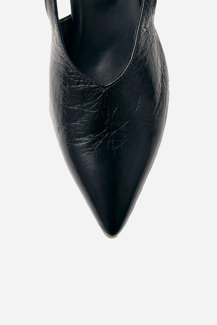Close-up of Alohas black crinkle leather pointed-toe pump with low heel and refined minimal construction at Alas Eius