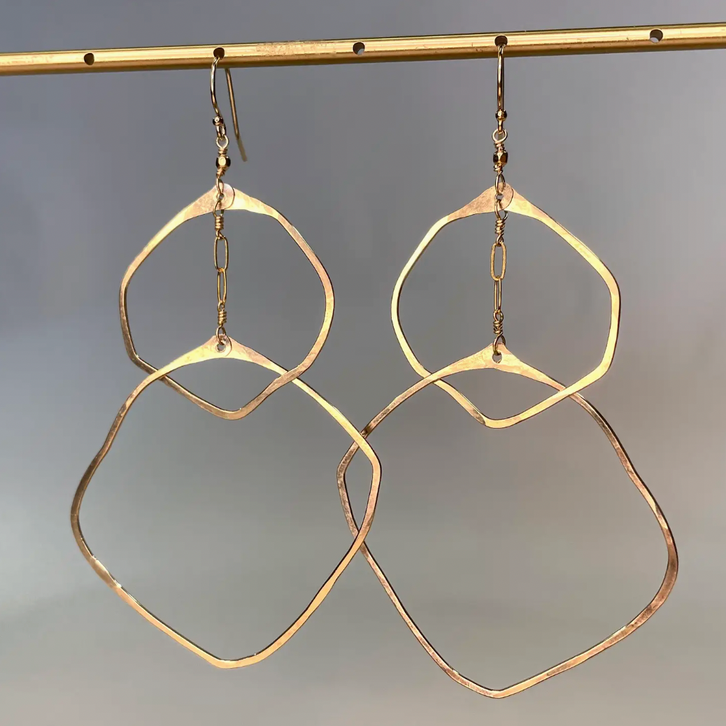 Beautiful hammered thin gold hoops in organic shape at Alas Eius