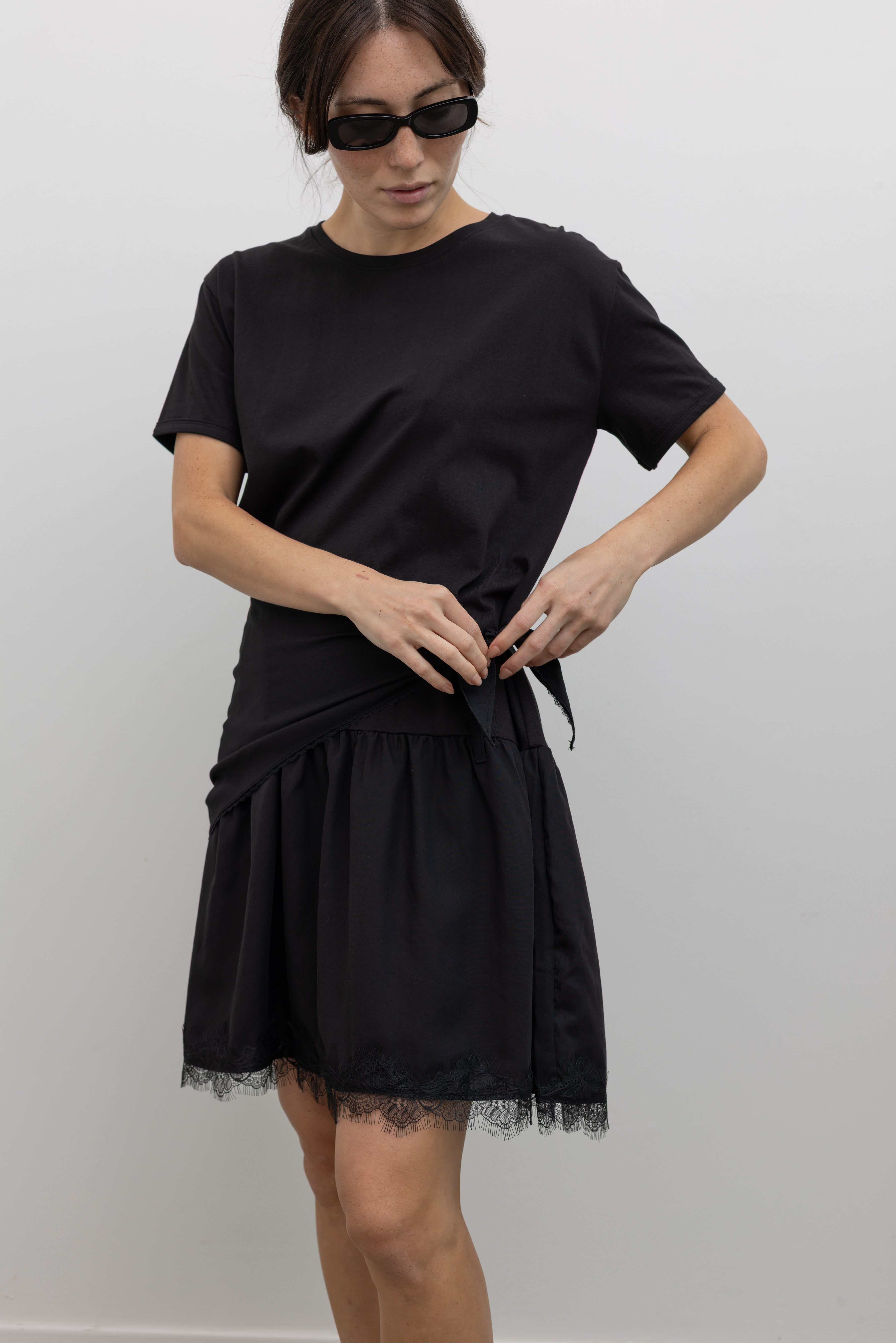 Collective black short sleeve mini dress with adjustable wrap detail and lace hem at Alas Eius