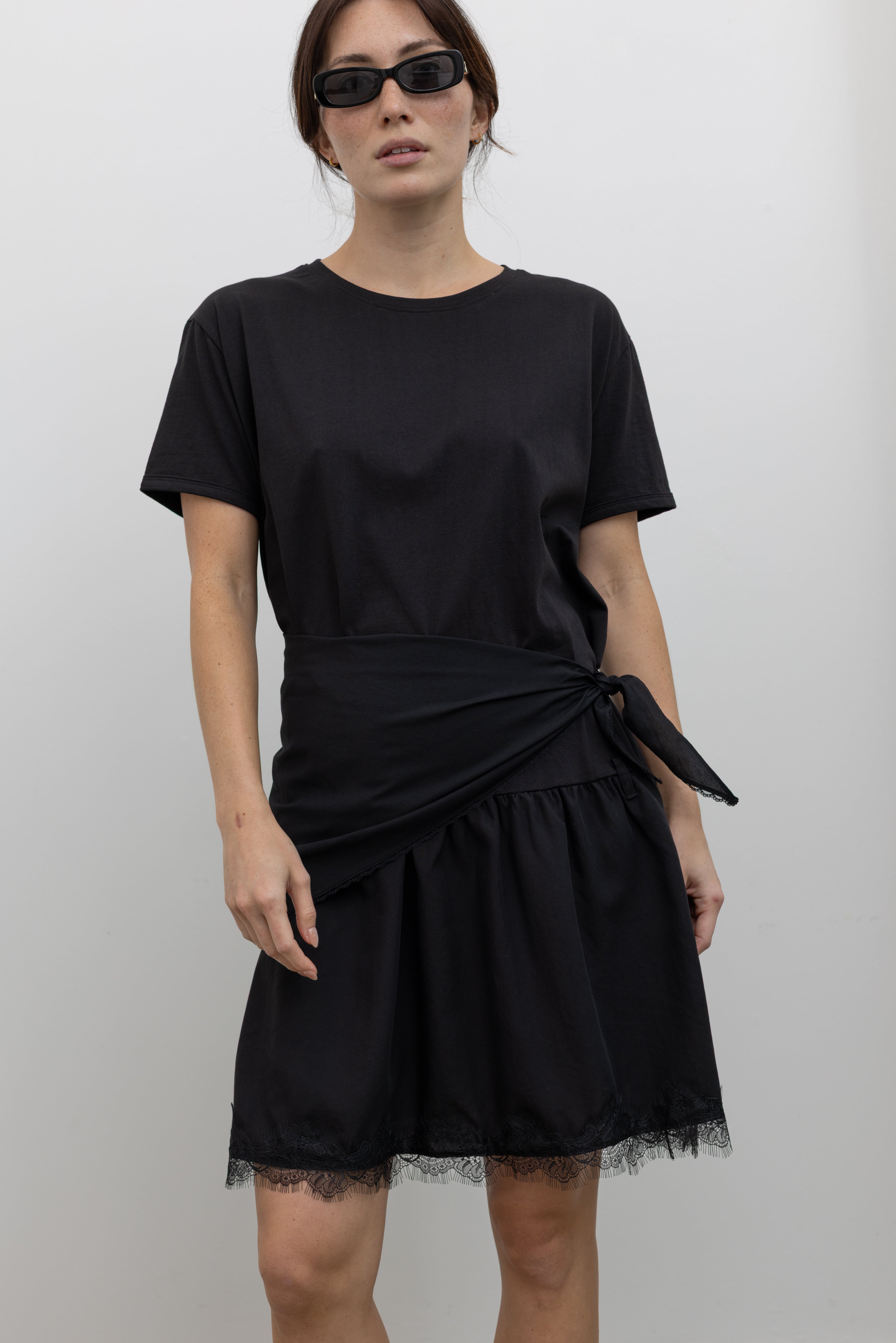 Collective black mini dress with wrap tie waist and eyelash lace hem at Alas Eius