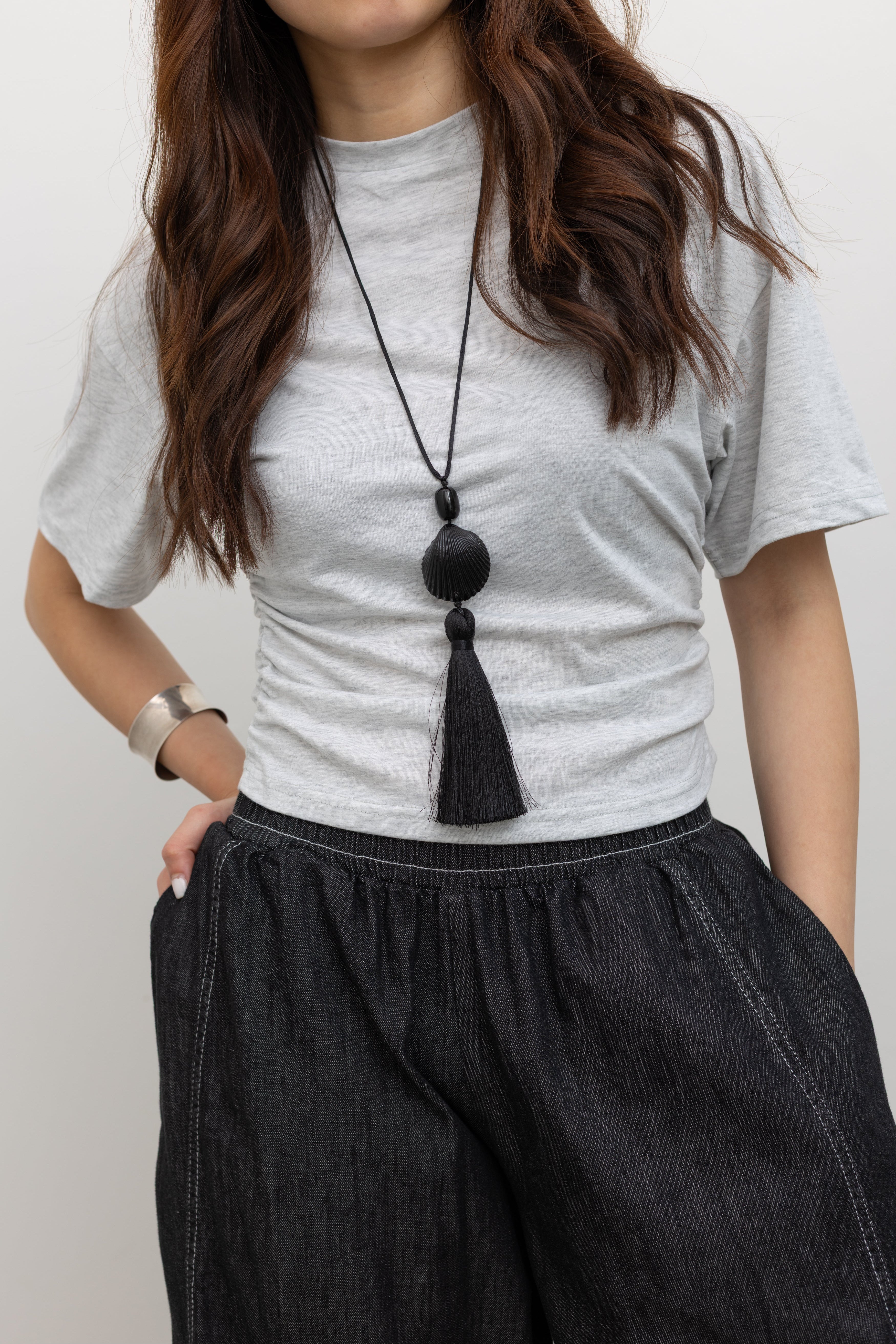 Collective light gray batwing sleeve cropped tee with side gathers and Alas Eius black contrast stitch barrel jeans.