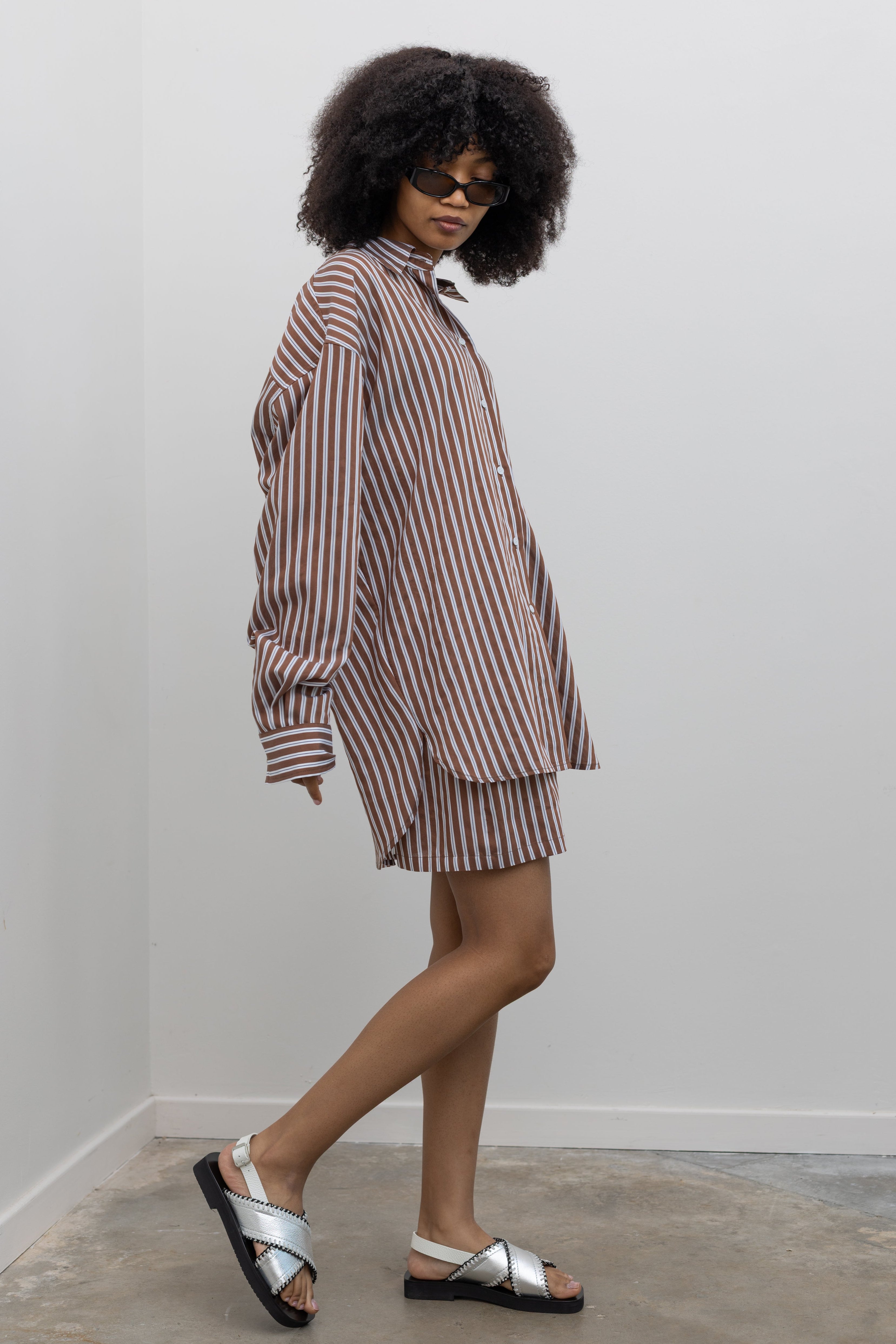 Collective oversized striped shirt with spread collar and asymmetrical hem at Alas Eius