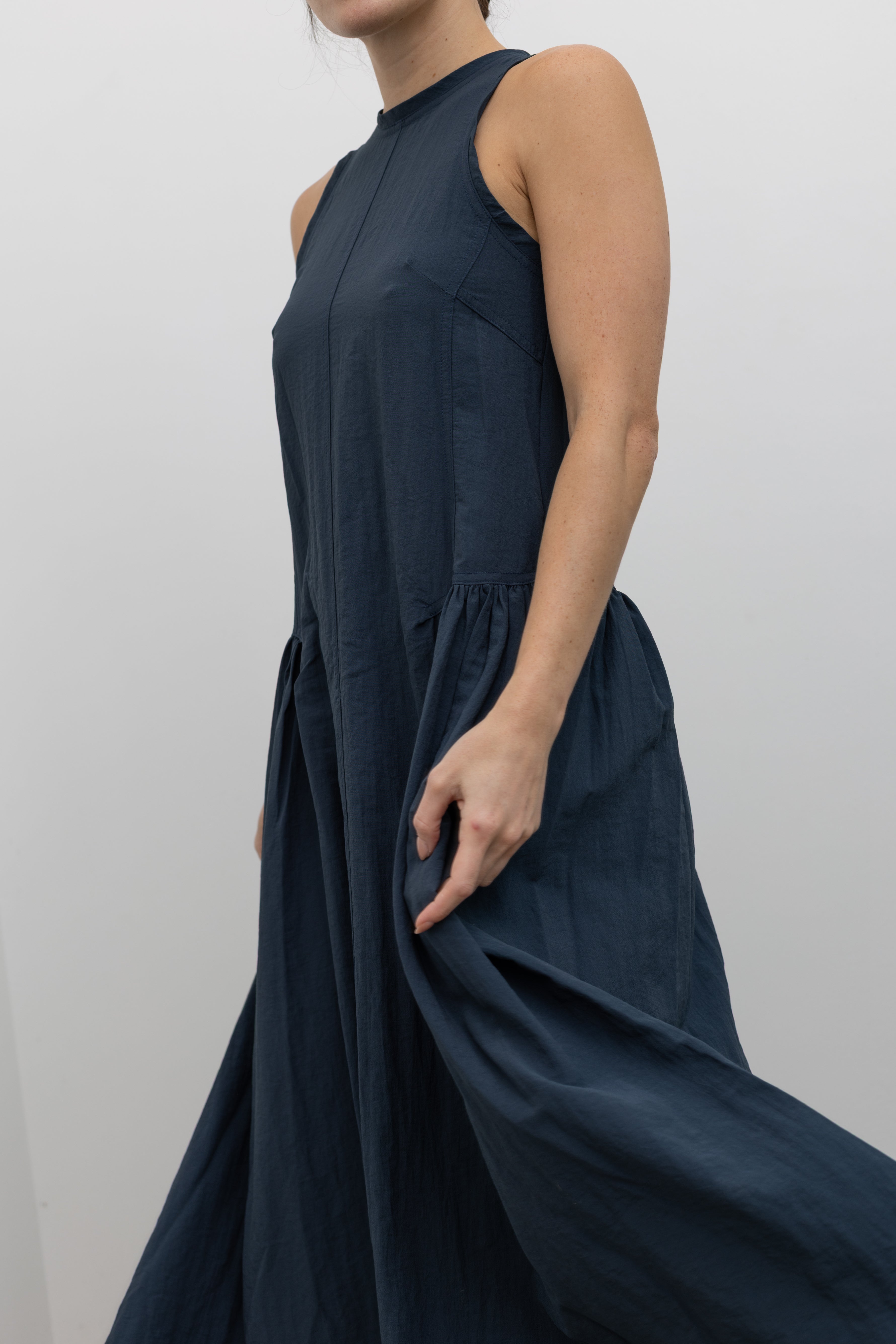 Collective sleeveless midi dress with structured panels and low gathered waist at Alas Eius