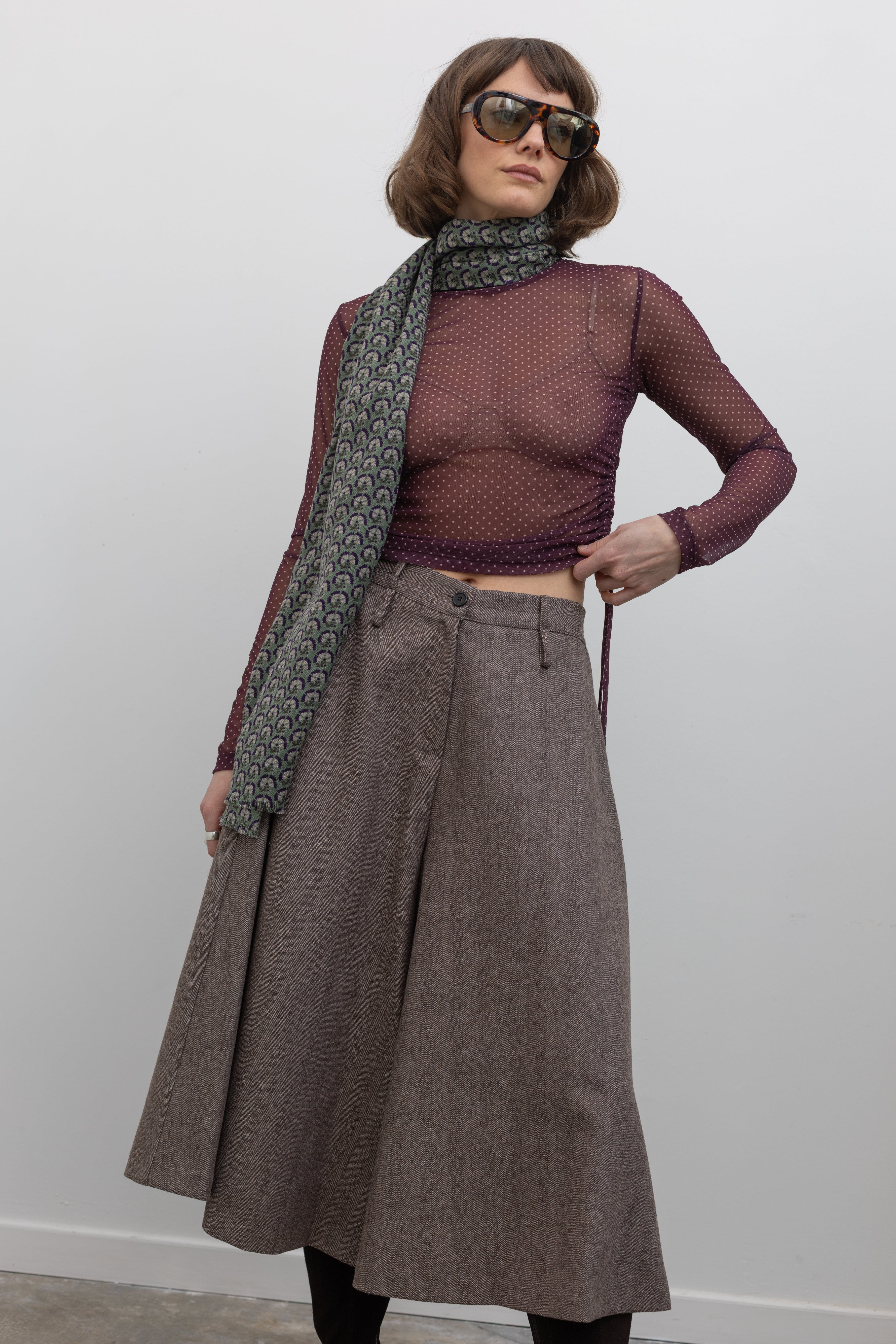 Woman wearing Collective Brown wool Herringbone Wide Leg Culotte Pants at Alas Eius