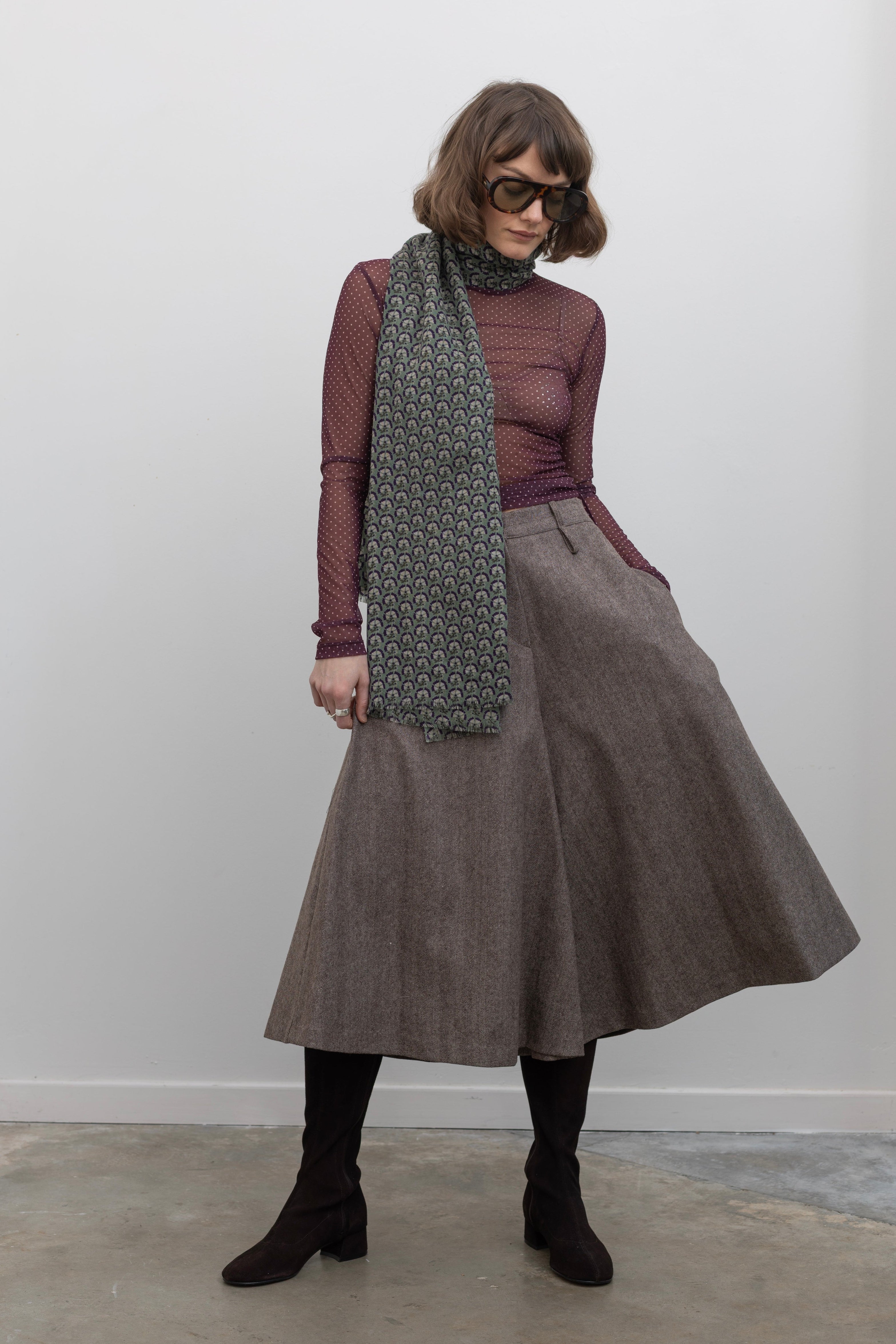 Woman wearing Collective Brown wool Herringbone Wide Leg Culotte Pants at Alas Eius