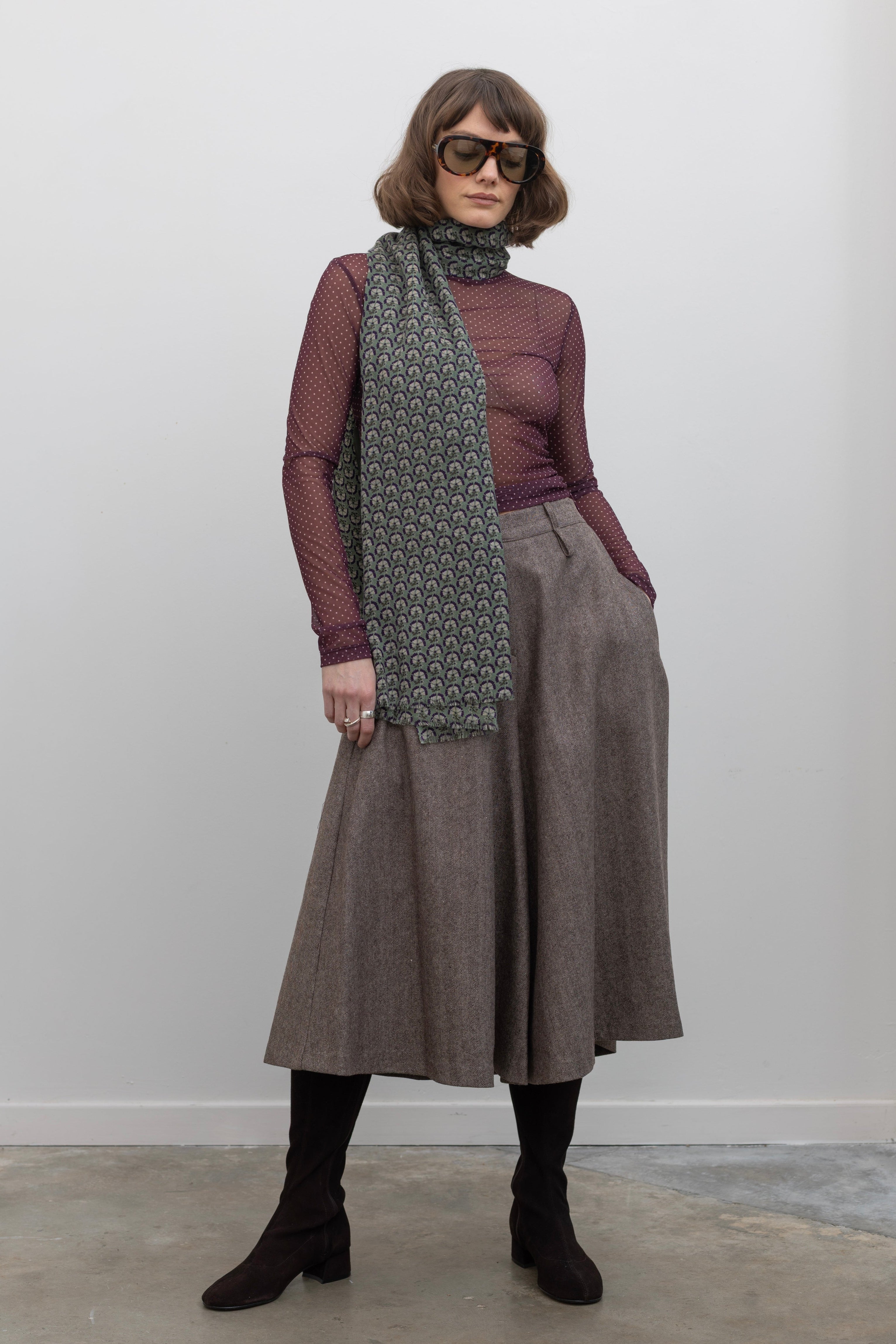 Woman wearing Collective Brown wool Herringbone Wide Leg Culotte Pants at Alas Eius