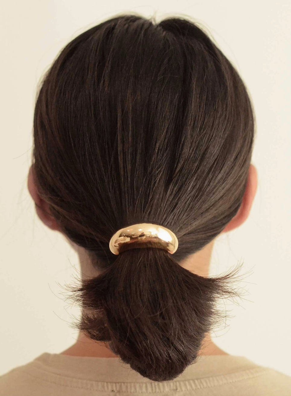 Woman wearing Collective Gold Crescent Metal Cuff Hair Tie Accessory at Alas Eius