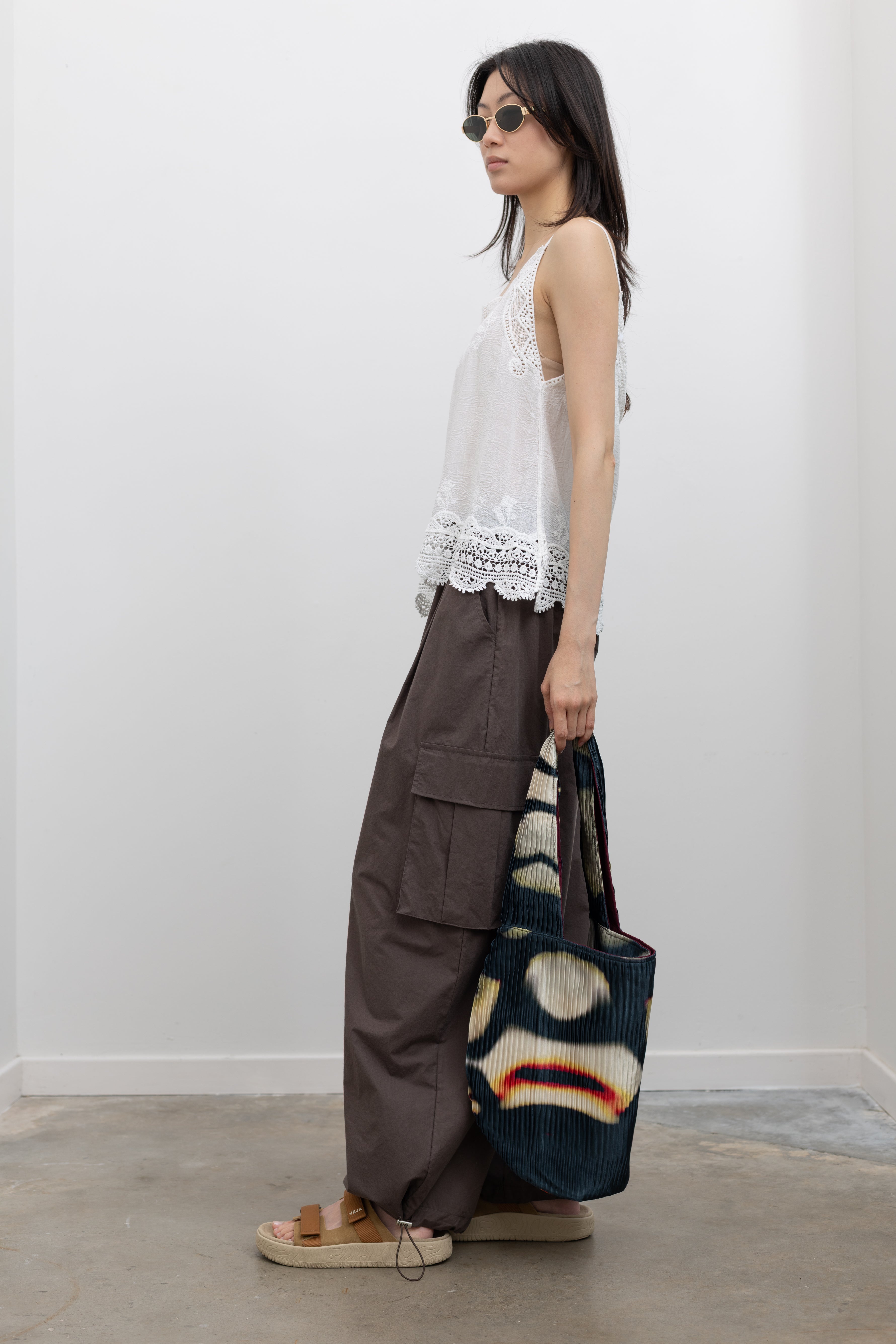 Collective effortless white cotton camisole with stone-washed texture and lace trim detailing, styled as a relaxed resort wear top and breathable summer essential for easy feminine styling at Alas Eius