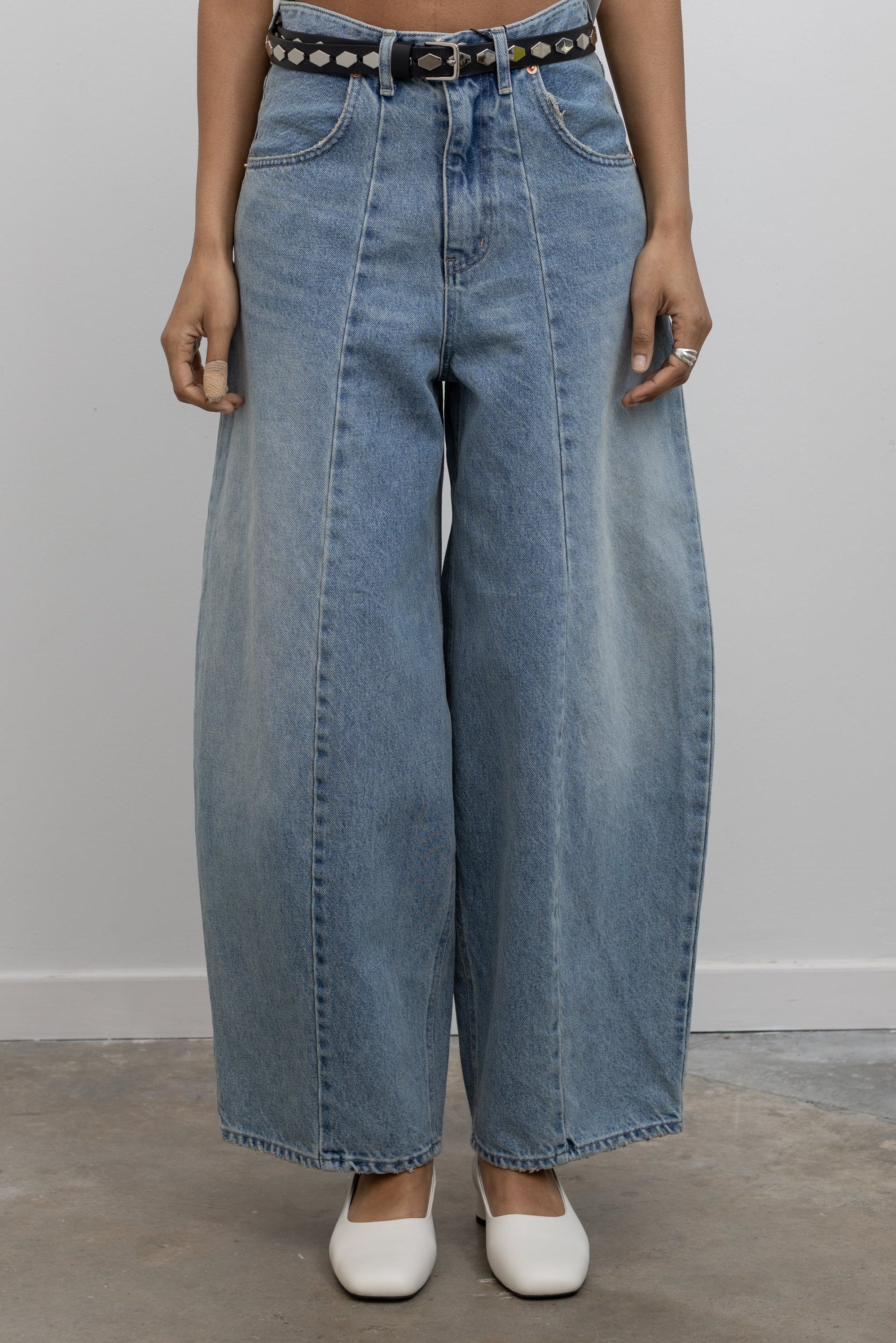 Detailed product front view of Collective Light Wash Front Seam Barrel Jeans at Alas Eius