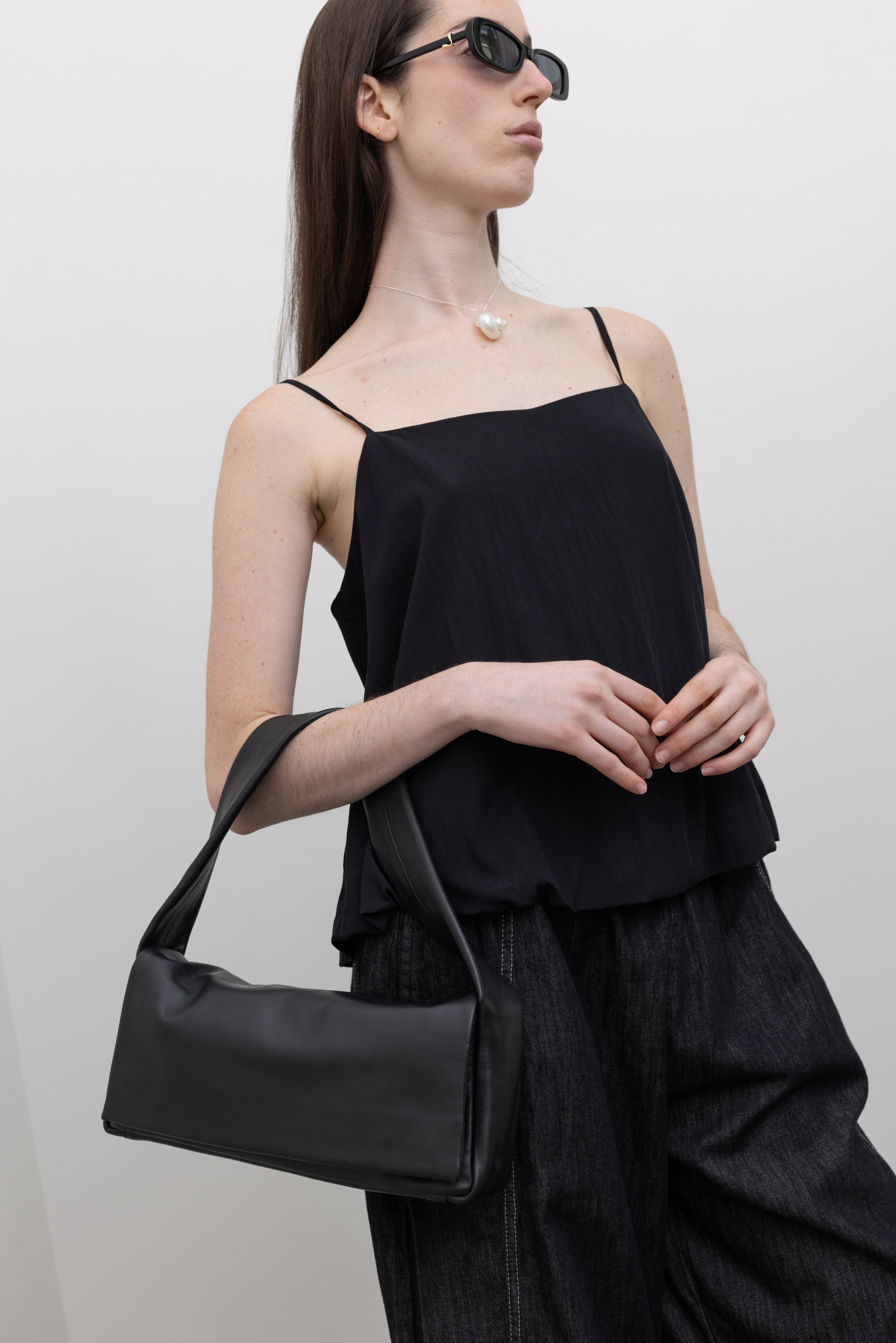 Collective women’s minimalist camisole in soft rayon blend featuring a square neckline, airy drape, and bubble hem, styled as a chic lightweight fashion tank top for modern wardrobe styling at Alas Eius
