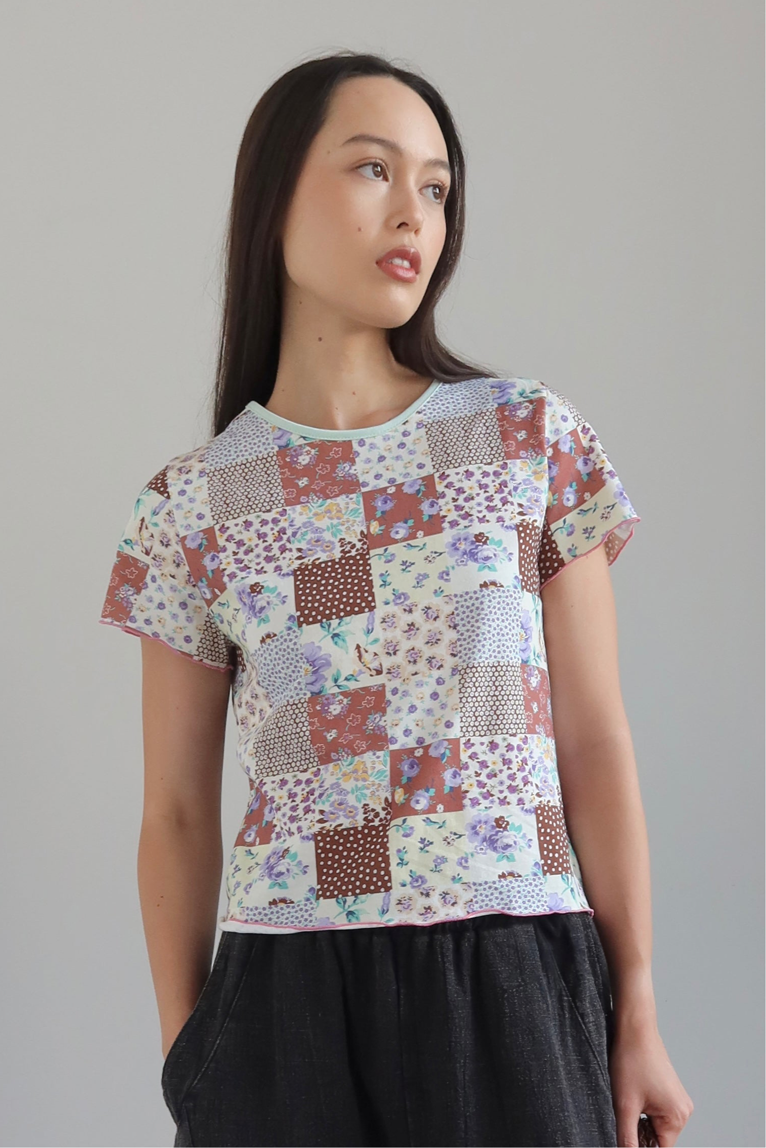 Woman wearing a Collective Quilted Pattern Floral Tee Shirt at Alas Eius