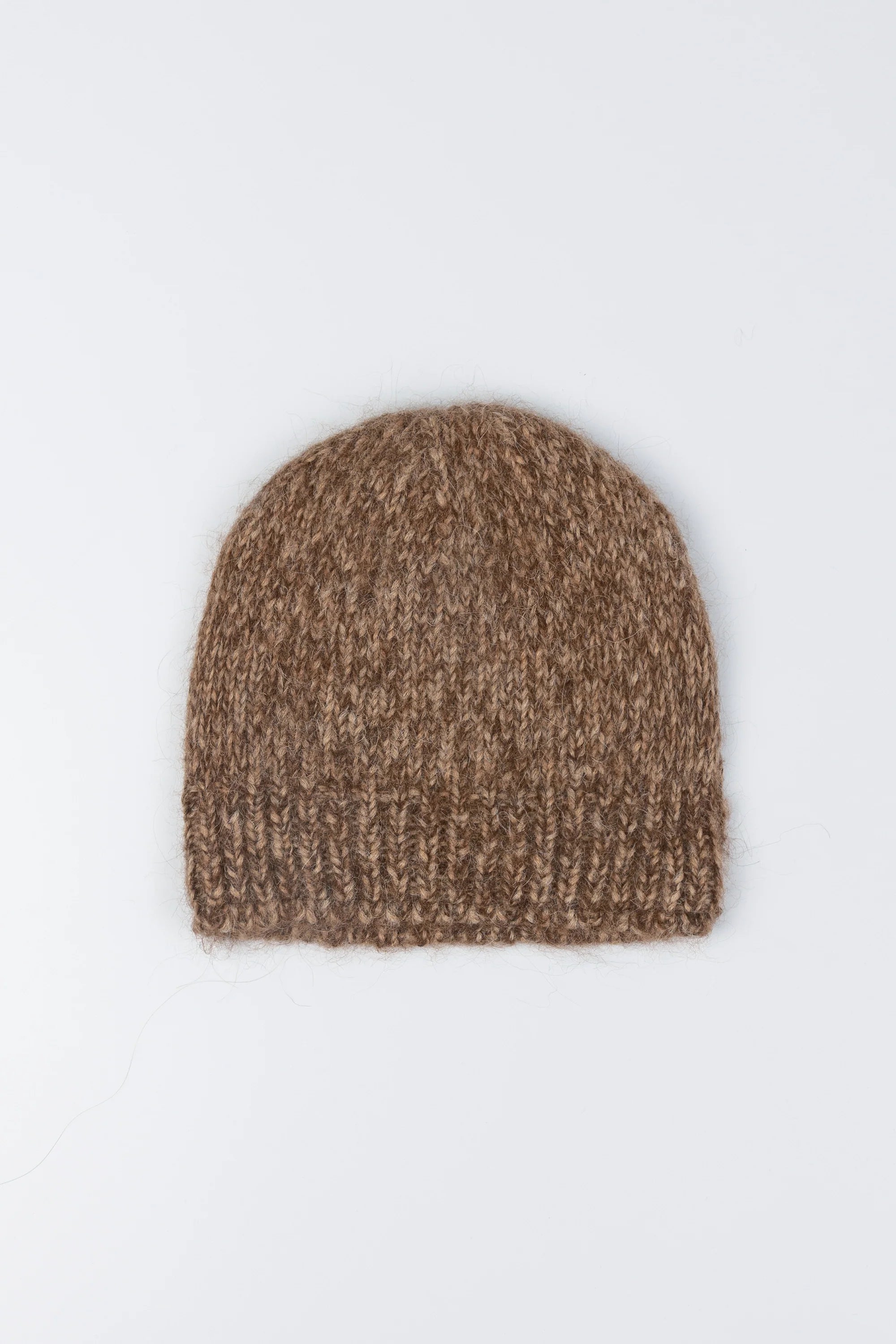 Product view of a winter fashion accessory in a Cordera Brown Alpaca Blend Melange Beanie at Alas Eius