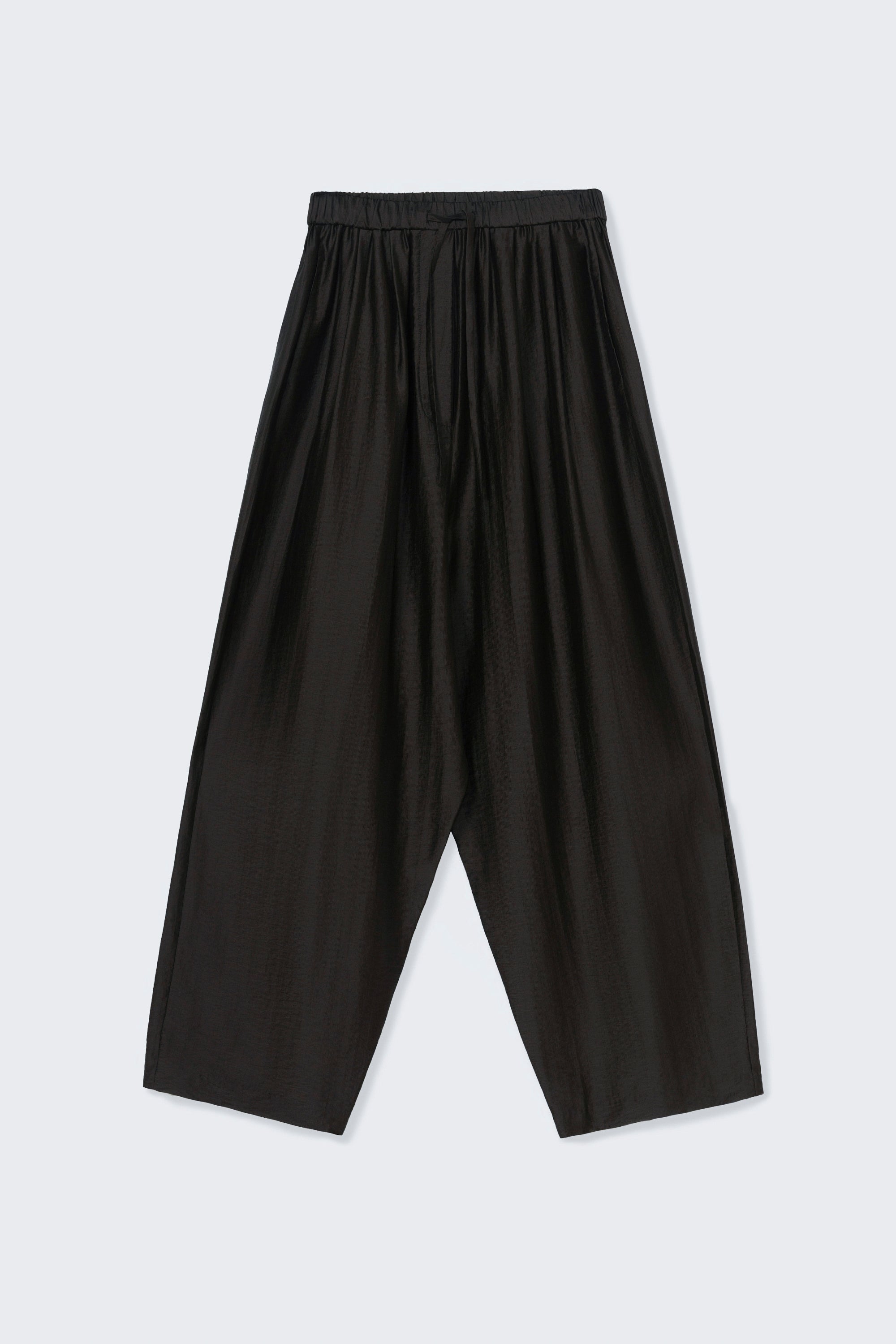 Front product view of chic and modern spring fashion in Cordera espresso brown maxi pants featuring a relaxed fit, drawstring elastic waistband, and side pockets at Alas Eius. 