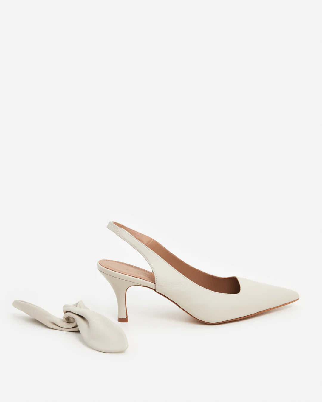 Side view of the Flattered Goat Leather Franchesca Removable Bow sling back Heels with pointed toe in Creme at Alas Eius