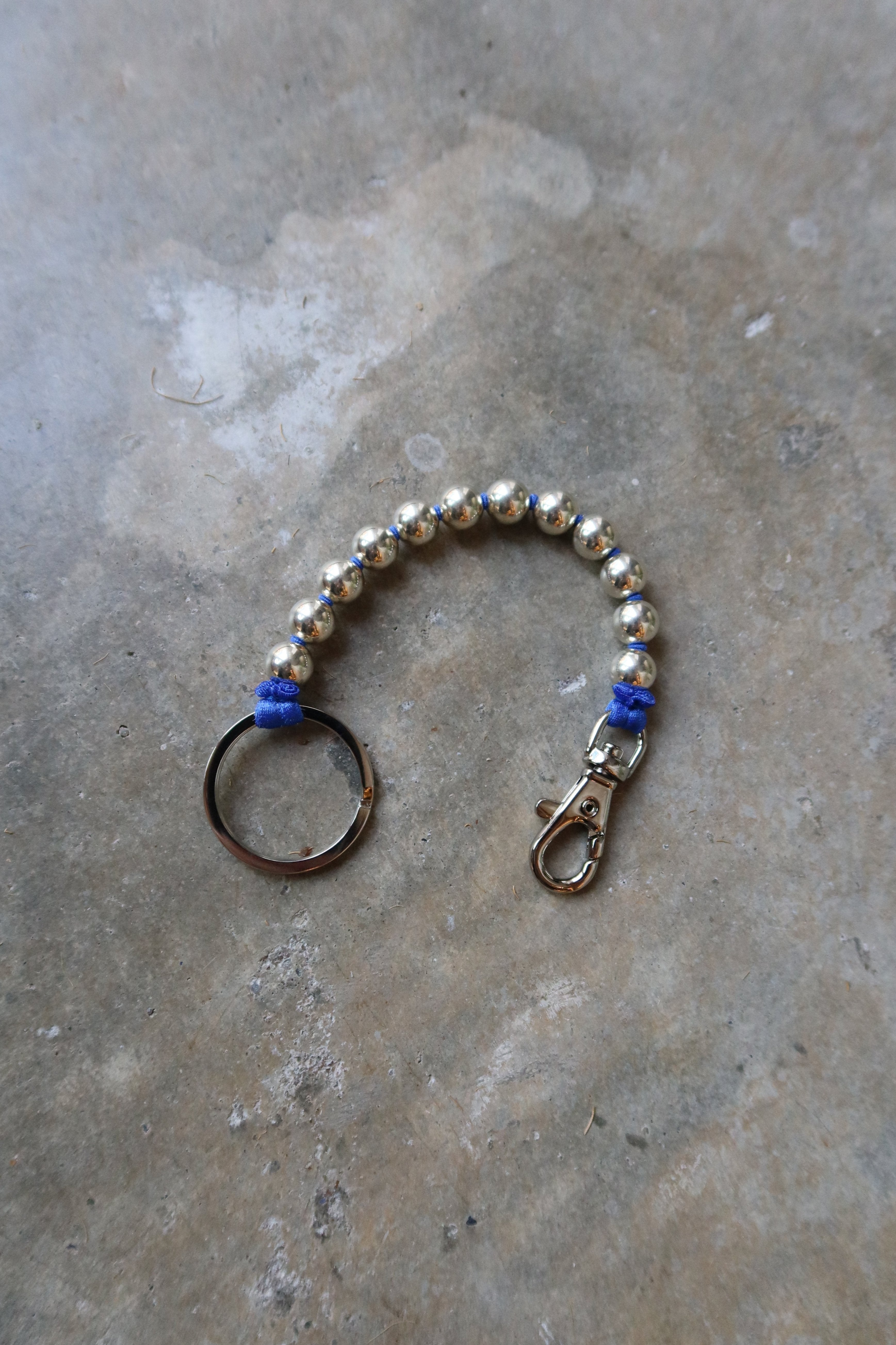 Sterling Silver And Blue Ribbon Keychain