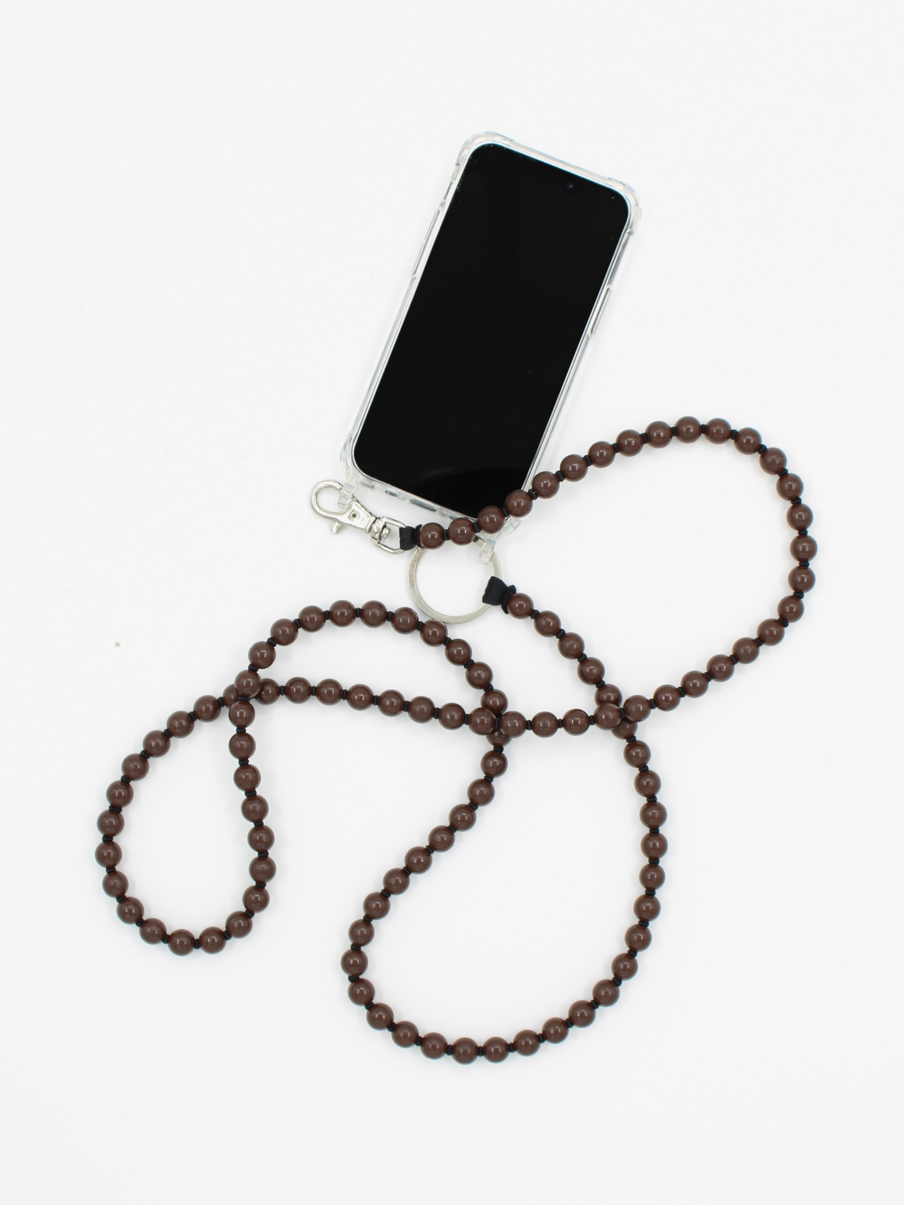 iPhone connected to a handmade phone necklace made with wooden beads finished with a vegan, non-toxic varnish at Alas Eius 