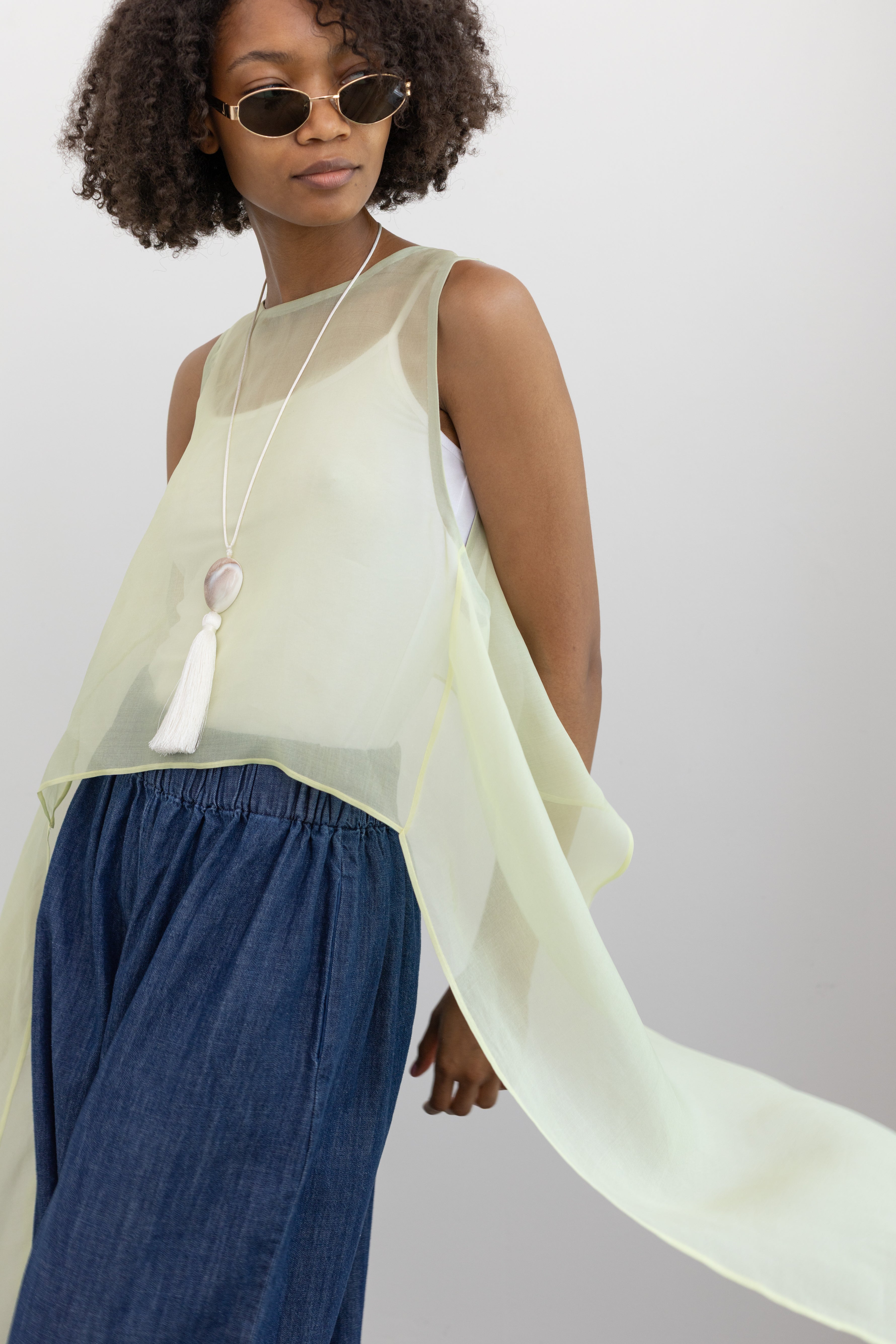 KAAREM Sheer silk organza top with a wide neckline and elongated side panels inspired by organic sea forms at Alas Eius.