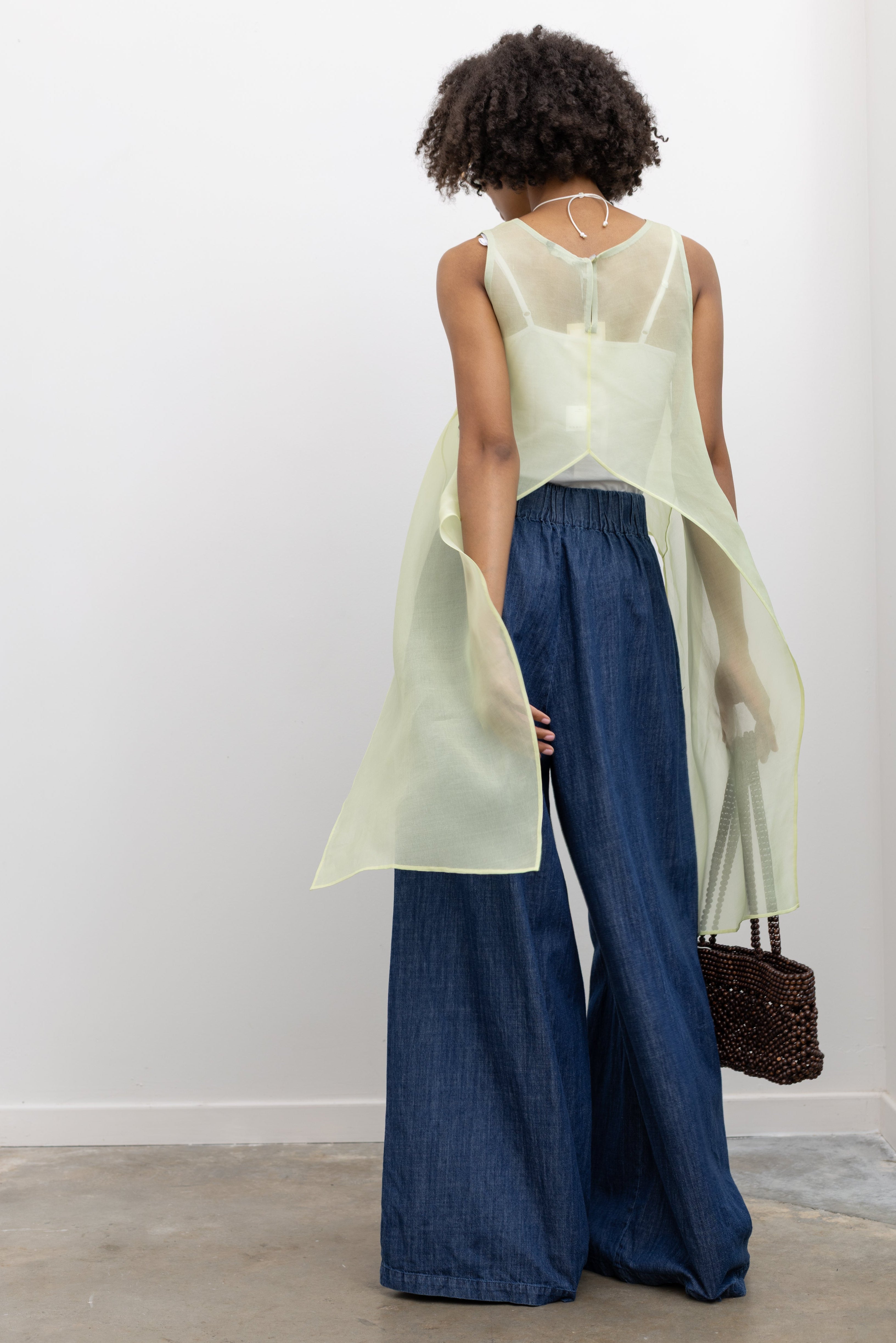 Ethereal KAAREM sheer top in 100% silk organza with fluid lines and architectural side extensions at Alas Eius. 