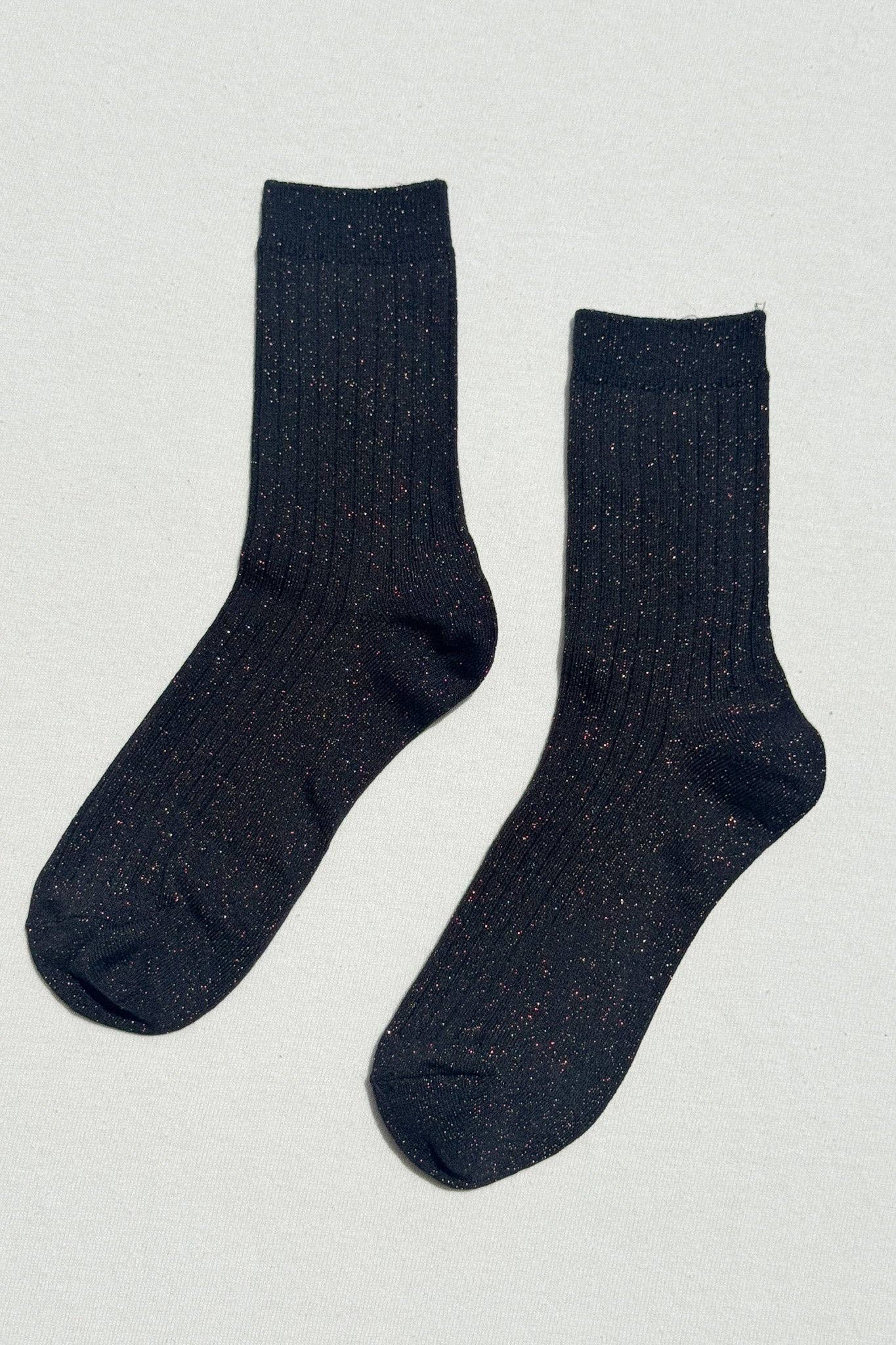 A pair of women's fashion ribbed crew socks in black with copper glitter by Le Bon Shoppe at Alas Eius 