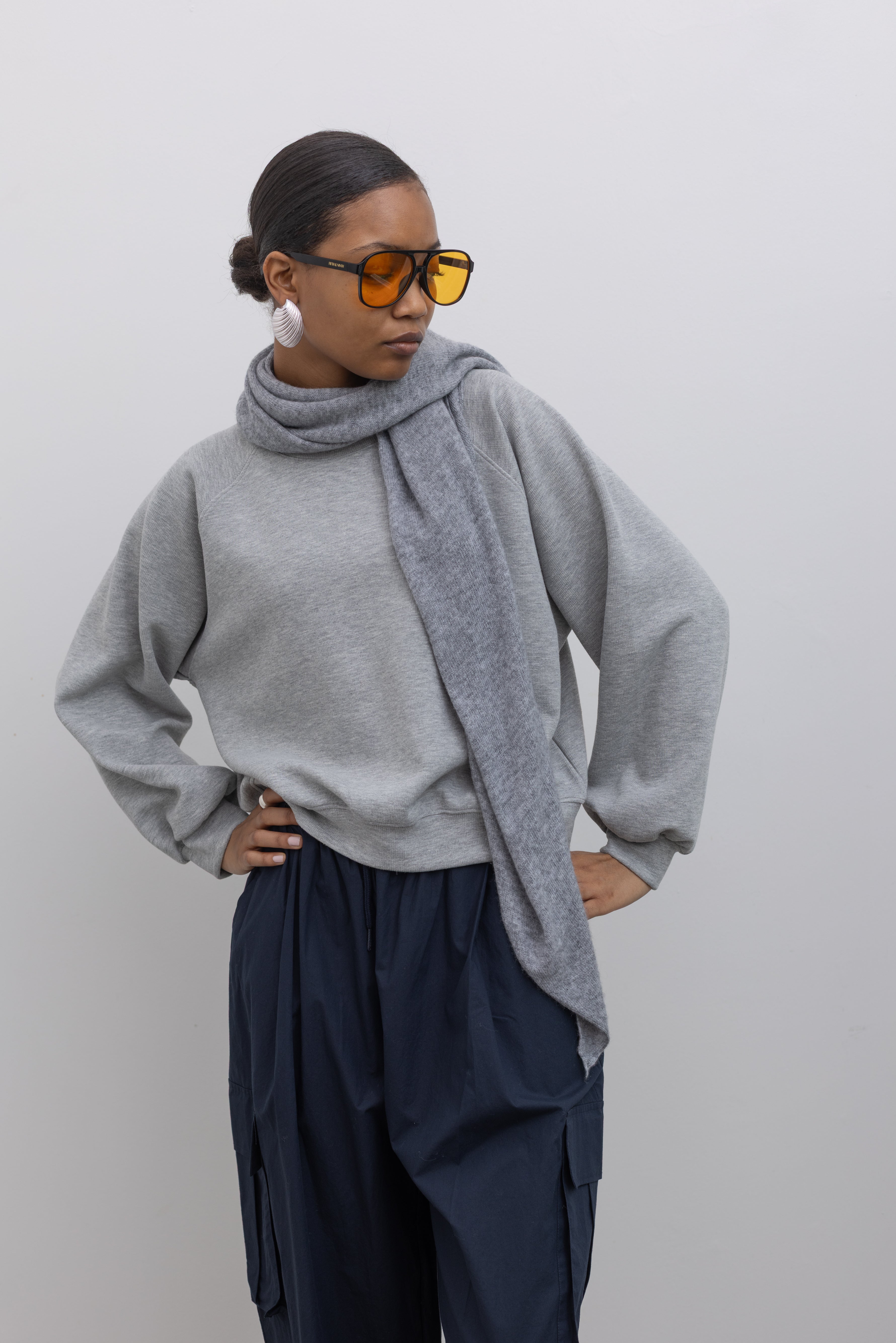 Woman wearing winter accessory in a Le Bon Shoppe Gray Cashmere Wool blend bandana Shawl at Alas Eius 