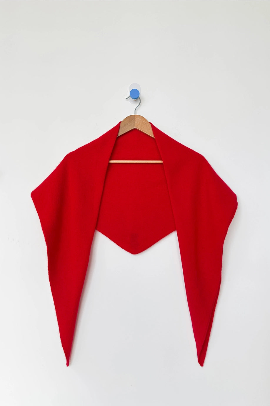 Le Bon Shoppe Red Cashmere Wool blend bandana Shawl on a wooden hanger at Alas Eius 