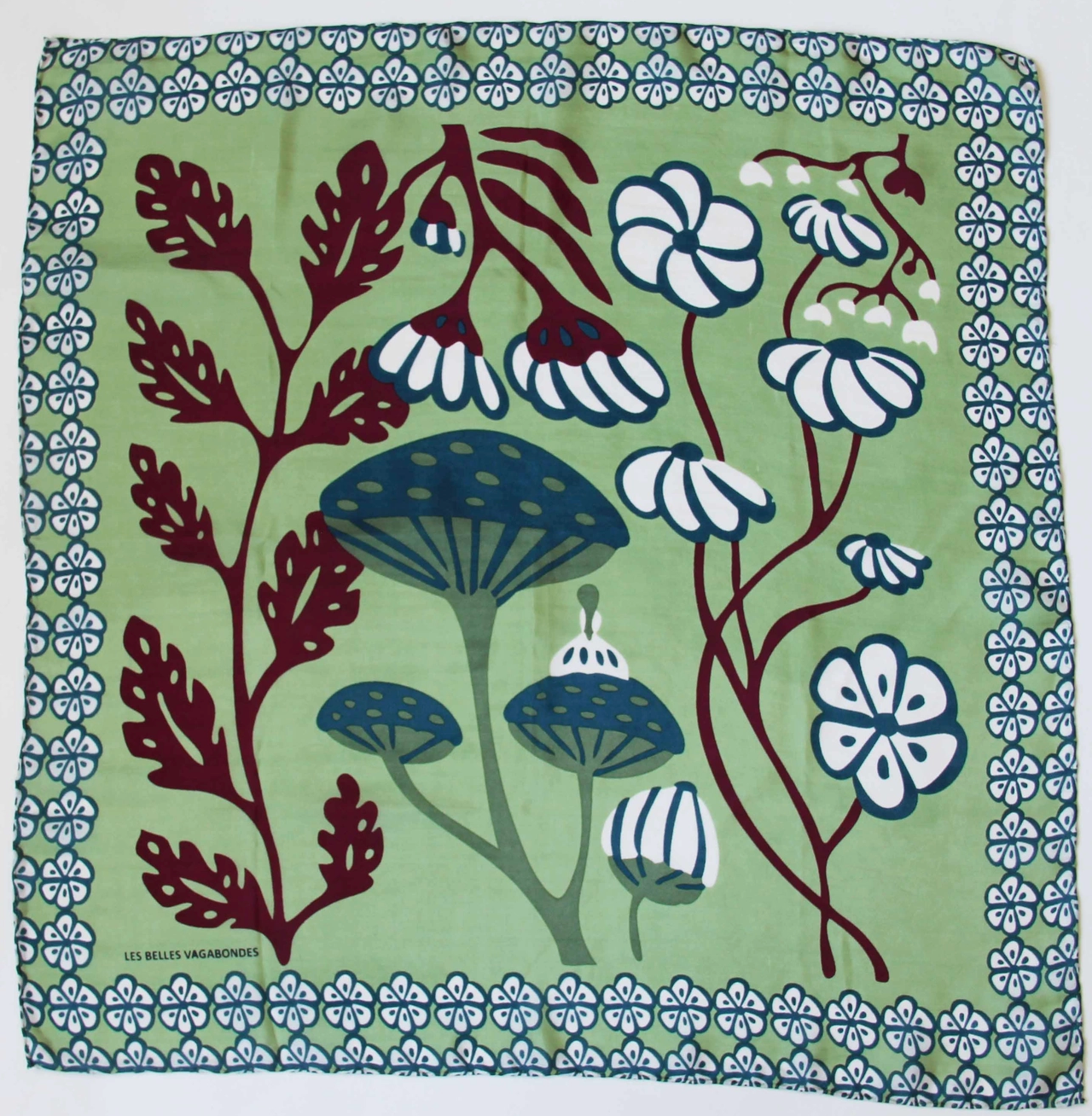 Product full view of a Les Belles Vagabones Alice Amande hand drawn floral and mushroom print silk scarf at Alas Eius. 