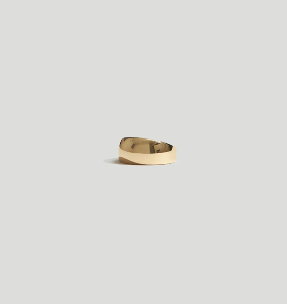 Product view of a contemporary style jewelry in a thick 14k gold plated dome ring at Alas Eius.
