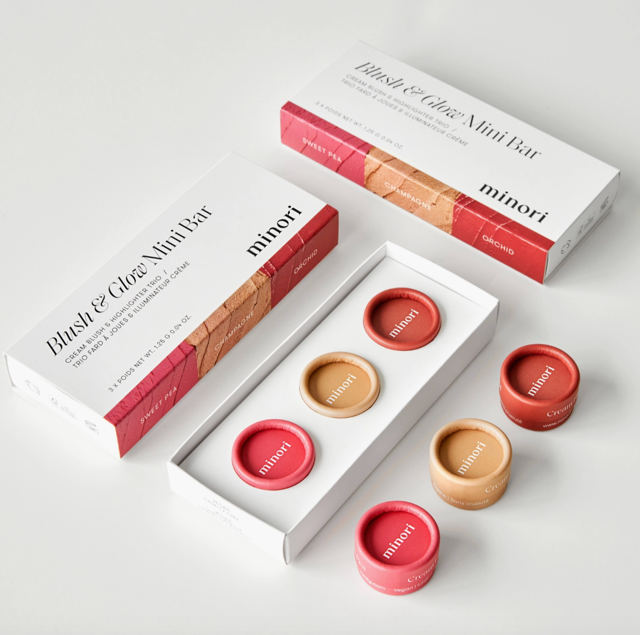Minori Blush And Glow Makeup Set with 2 cream blushes minis and a cream highlighter mini. Comes in travel friendly, zero-waste paper packaging at Alas Eius
