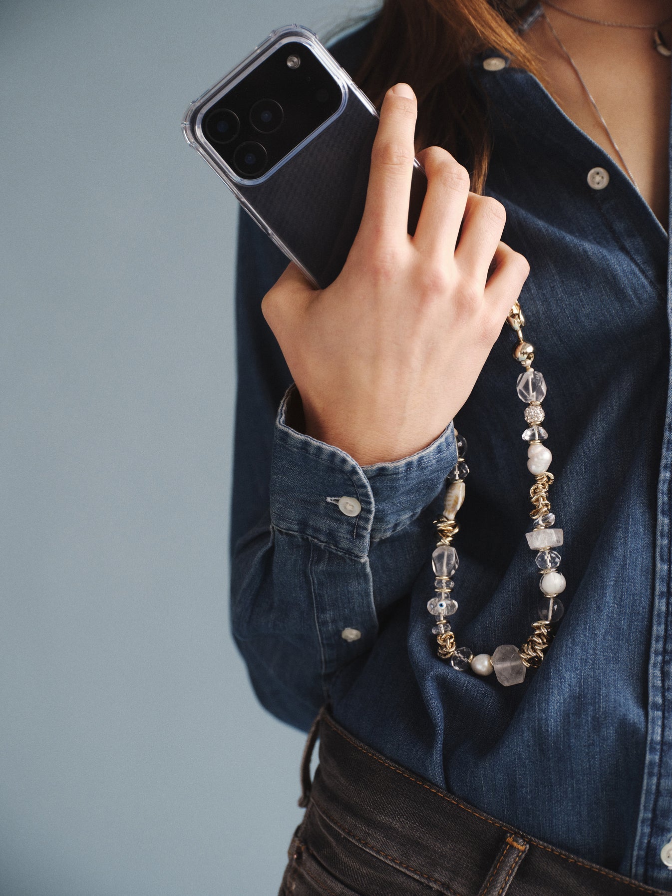 Gemstone and motif beads strung together with chain link details to create the Ossa Crystal Et Cetera Wristlet iPhone Accessory at Alas Eius.