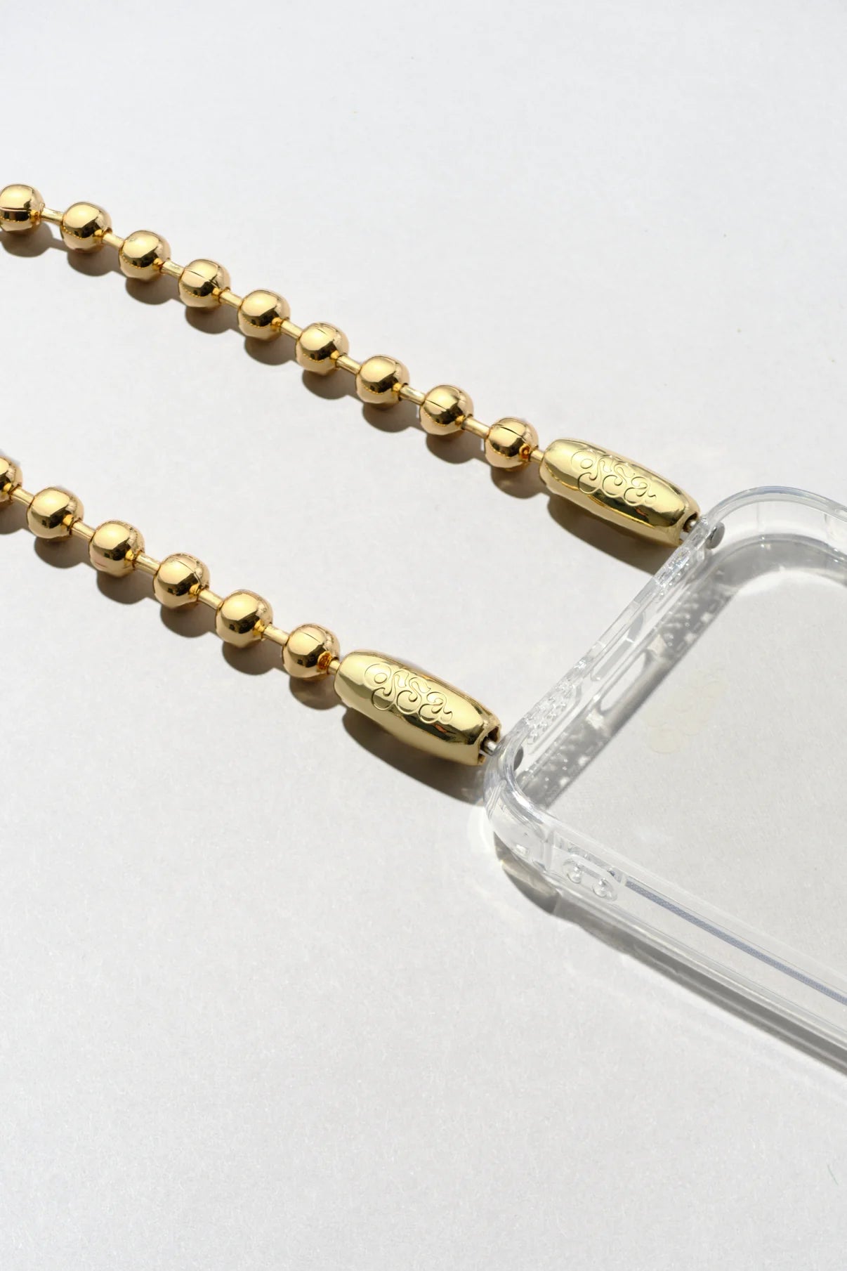 Close-up detailed view of the Ossa Ball Chain iPhone Wristlet Cord in High Polished Metal at Alas Eius