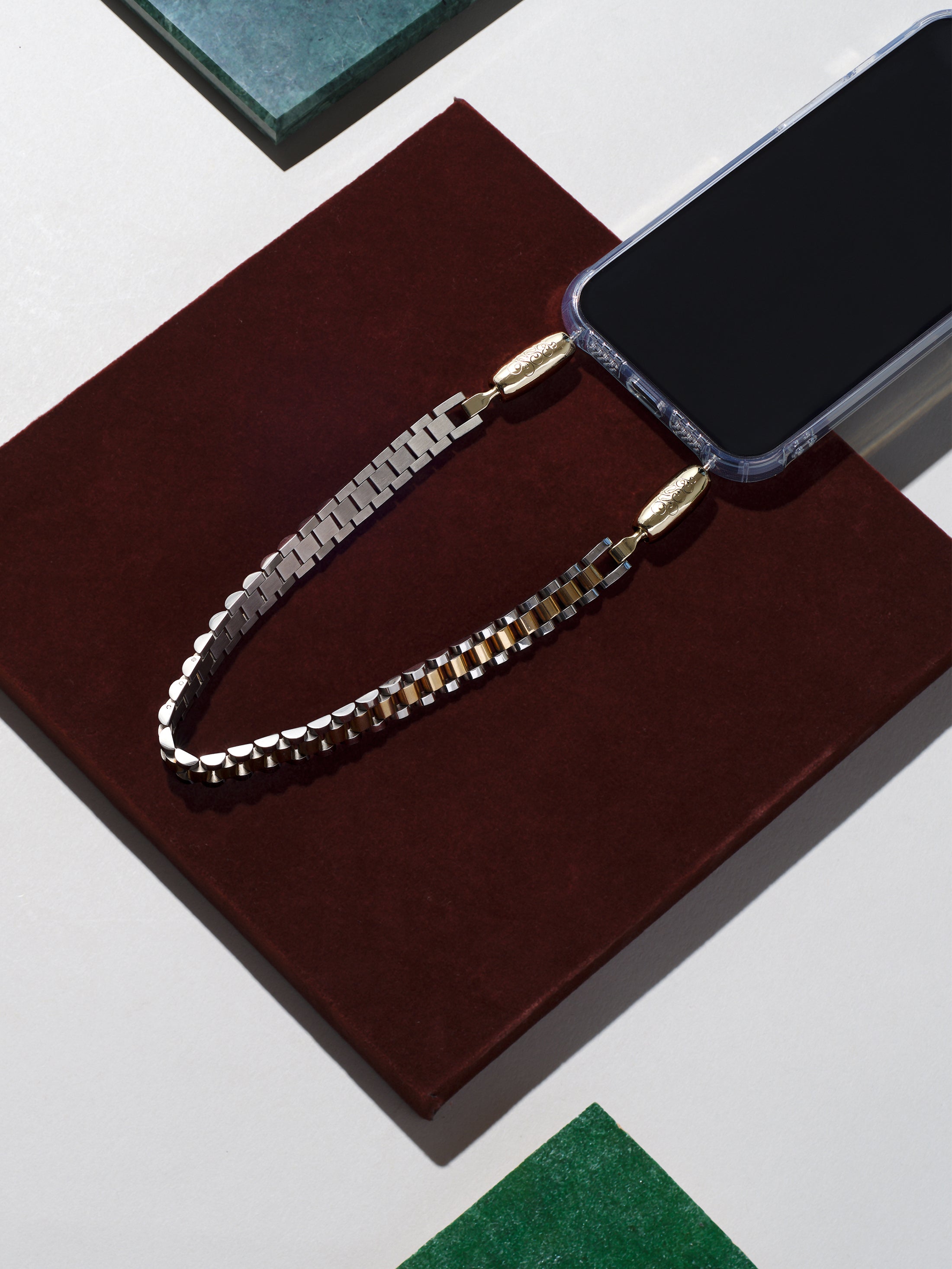 Gold and silver watchband links create the Ossa Jubilee watchband Wristlet iPhone Accessory at Alas Eius.