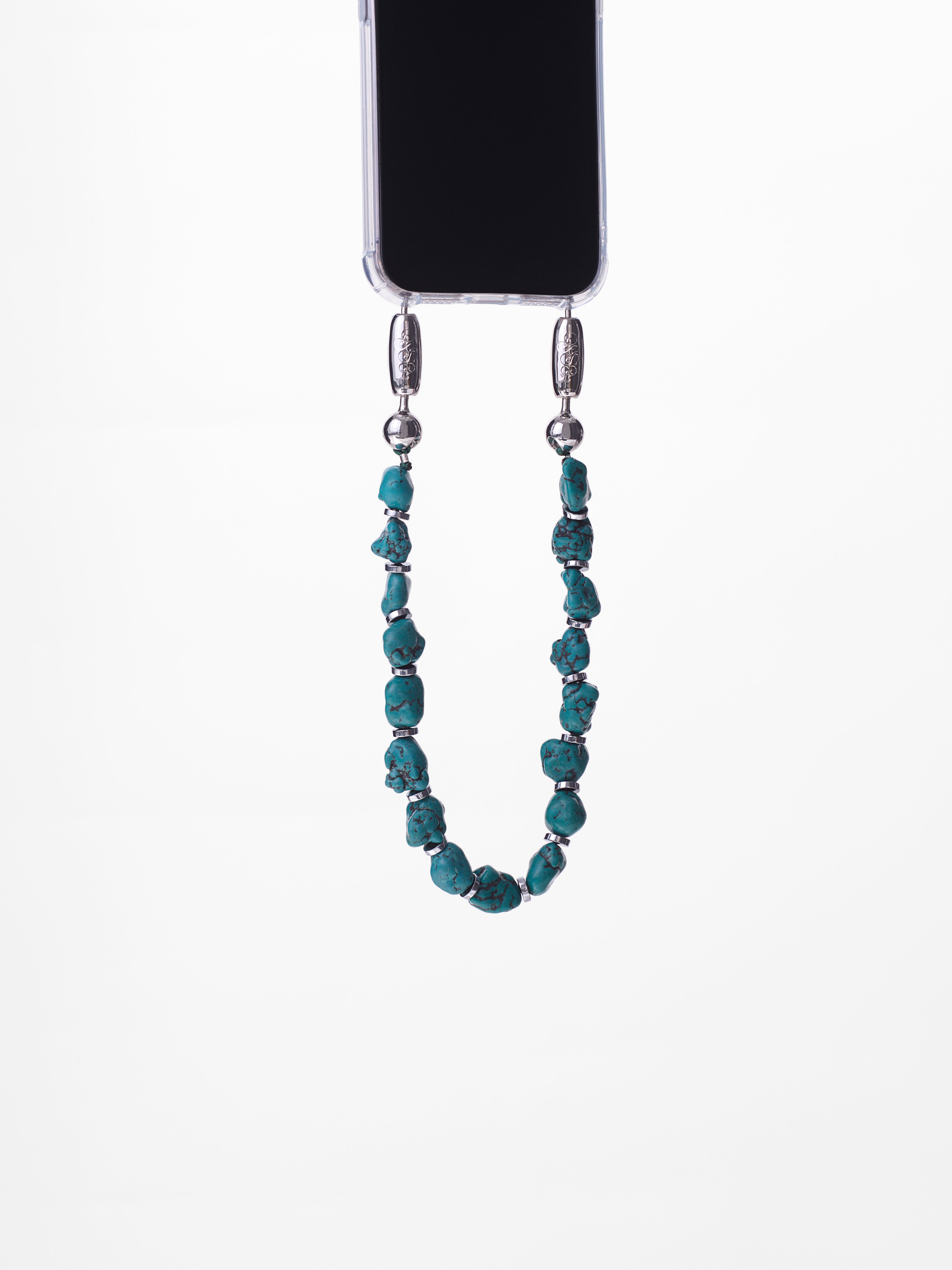 High polished gemstone chips strung together with silver hematite disks to create the Ossa Turquoise linked gemstone iPhone wristlet chain accessory at Alas Eius. 