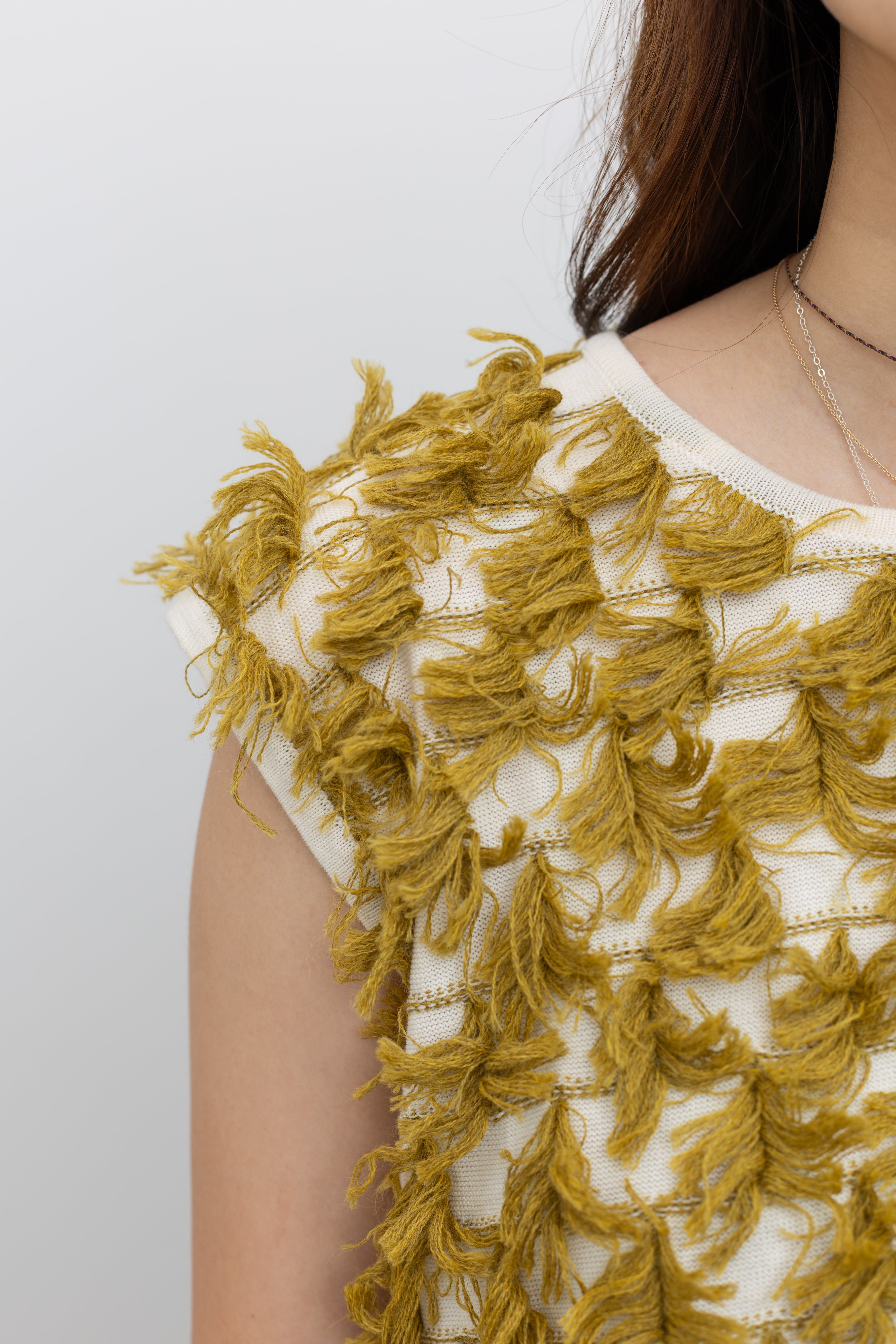 Rachel Comey boxy sleeveless knit featuring soft crew neckline and sculptural fringe movement detail at Alas Eius. 