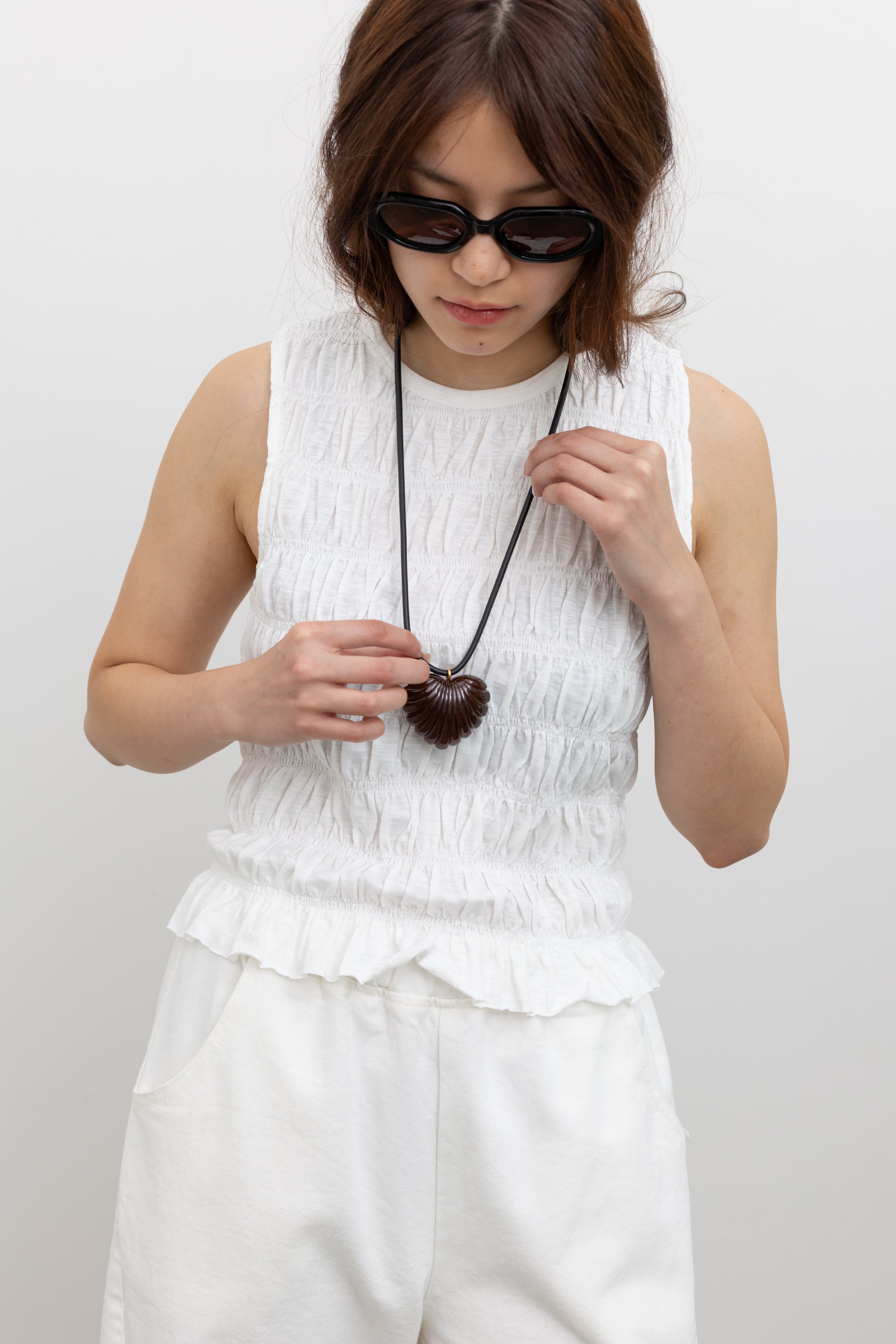 Rachel Comey Acrylic sculptural heart pendant on slim leather cord styled as a single or double wrap necklace at Alas Eius