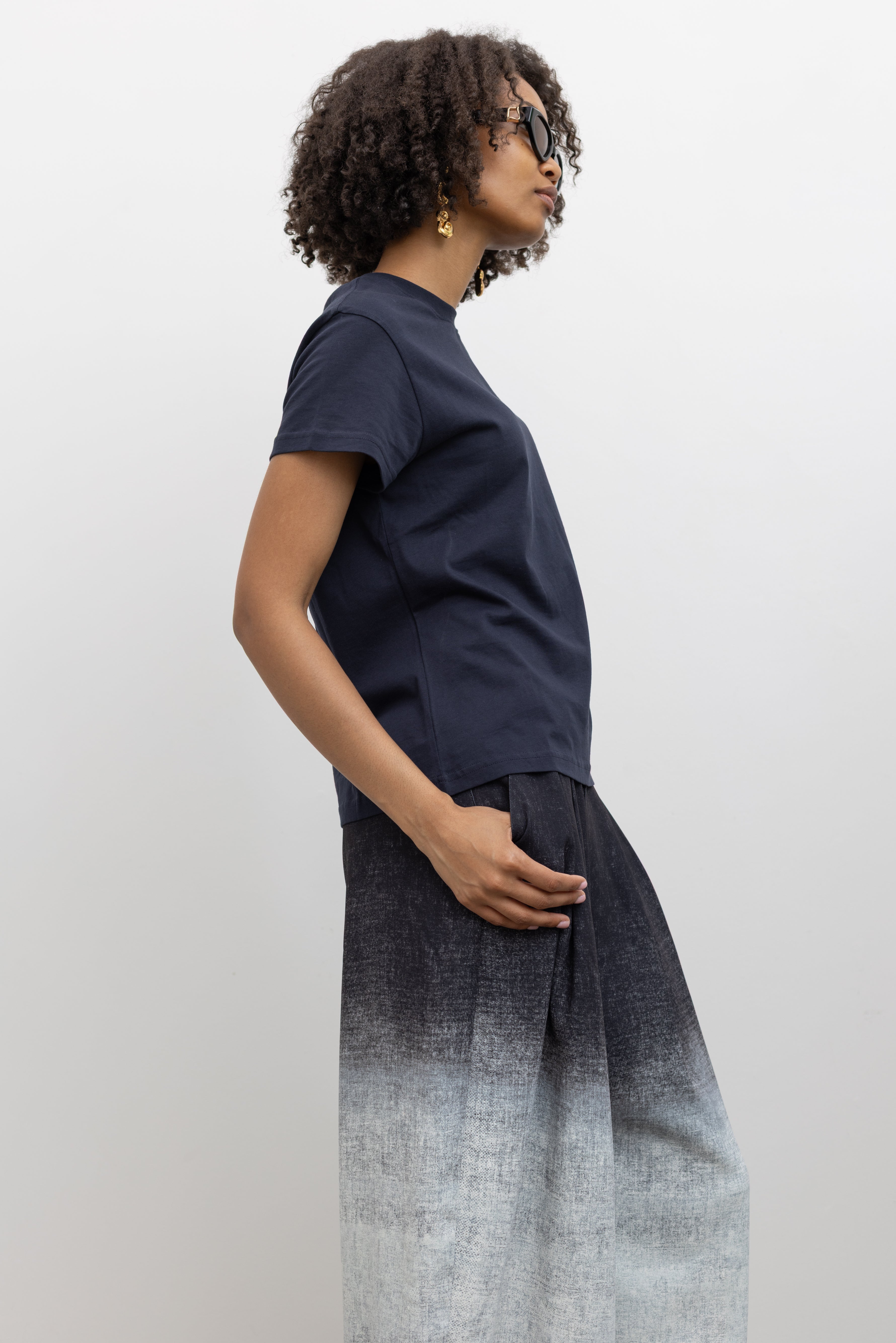 Rachel Comey high-rise trousers with slanted side pockets, rear patch pockets, and concealed front closure at Alas Eius.