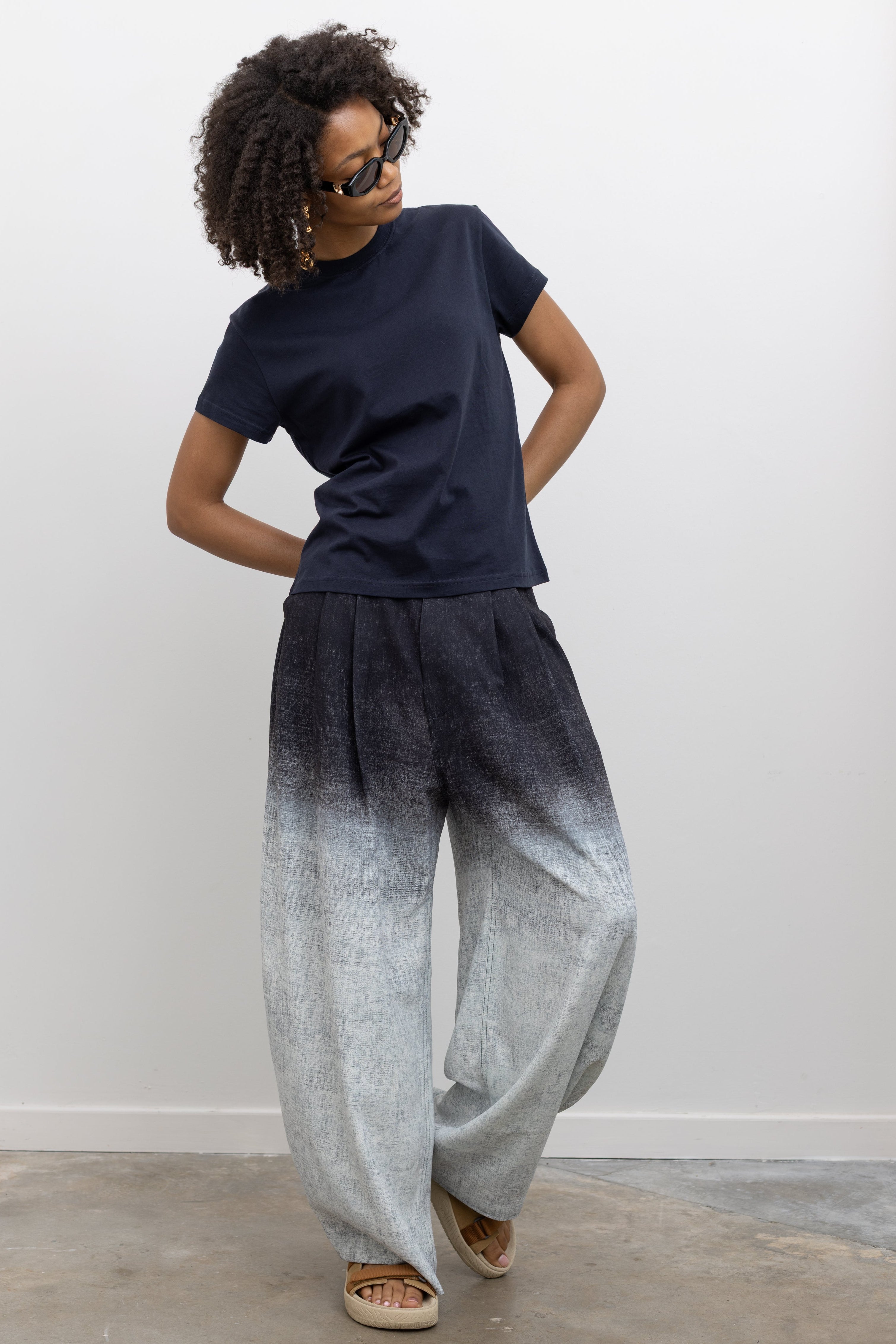 Rachel Comey relaxed fit trousers featuring a flowing wide-leg silhouette, belt loops, and side pockets at Alas Eius. 