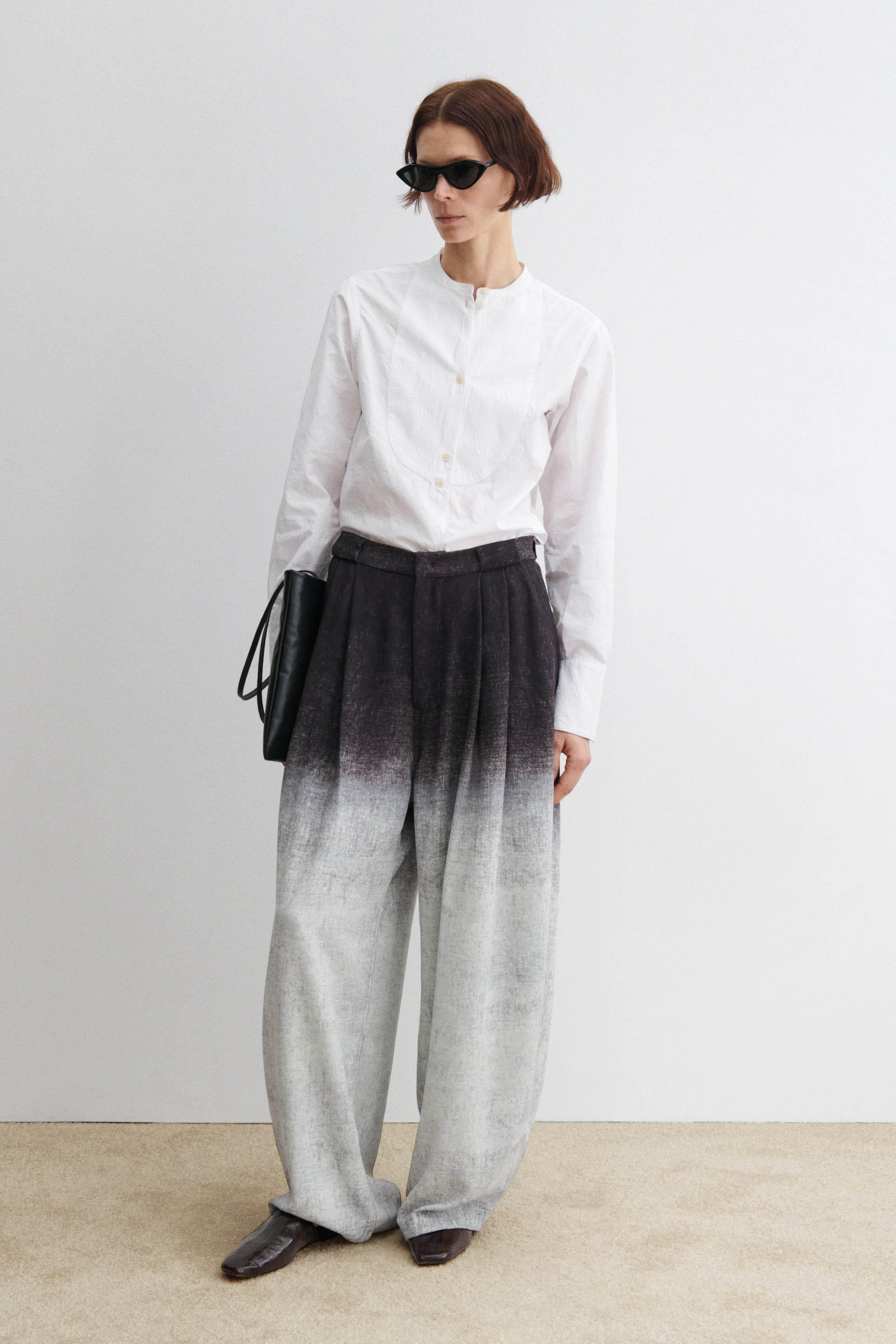 Rachel Comey flowing high-waisted pants featuring a relaxed silhouette and subtle ombre fabric effect at Alas Eius.